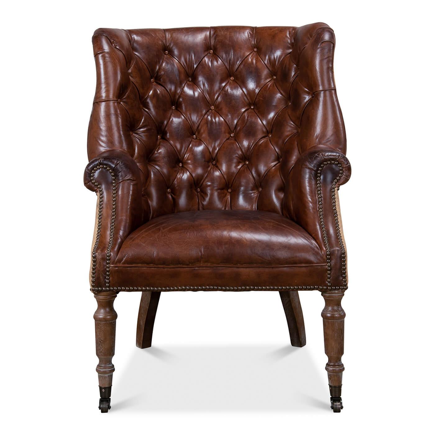 A wonderful George III style barrel back wingchair with top-grain vintage cigar colored leather, a tufted upholstery barrel backrest with winged sides, rolled arms and a padded seat with the reverse covered with jute. Finished with brass nailhead