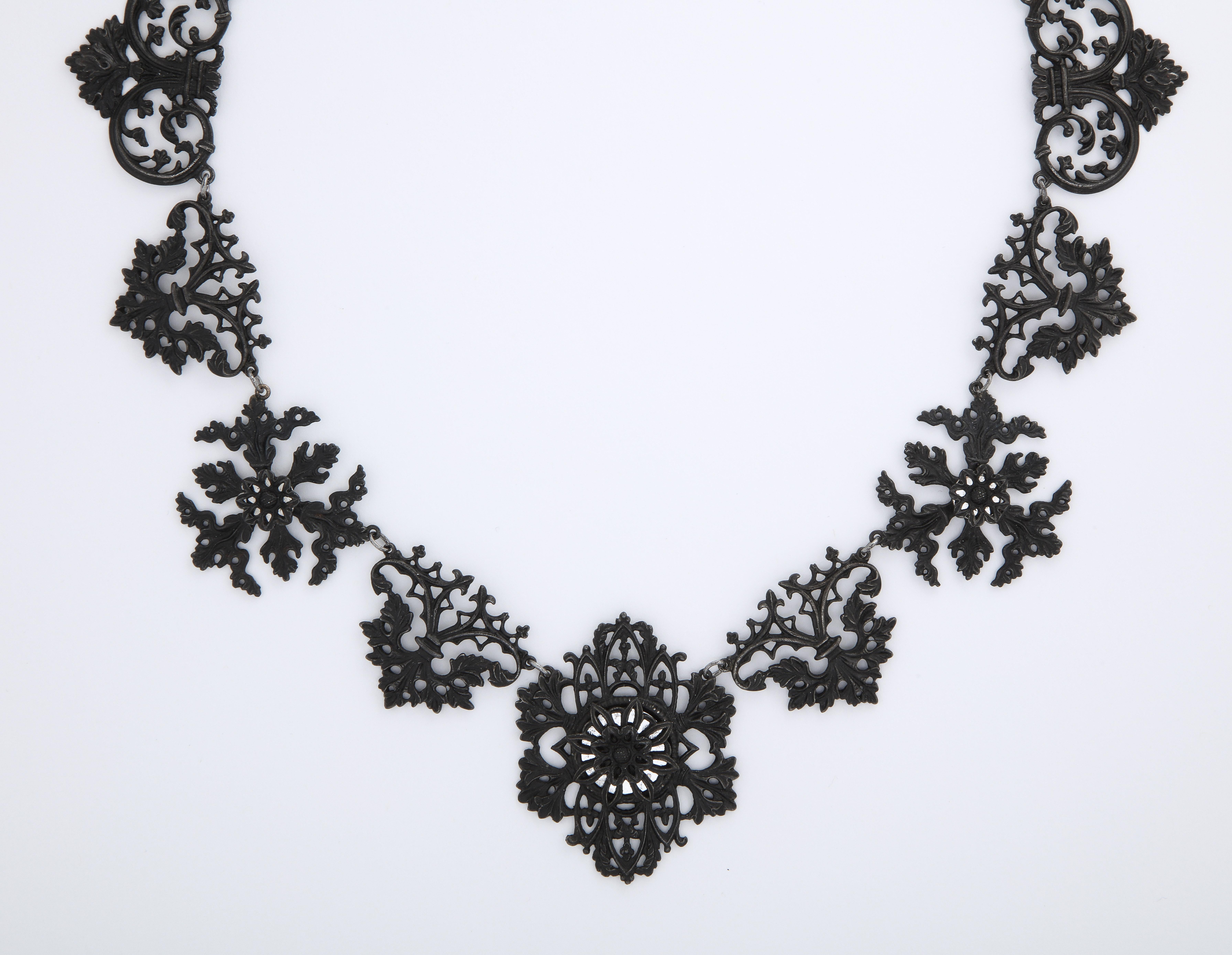Think of lace made from iron when you view this Berlin Iron necklace with links of leaves, flowers and frills. It is rare to be able to purchase this jewelry. It can be found mostly in museum collections, at times, only in fragments. 
Made in the