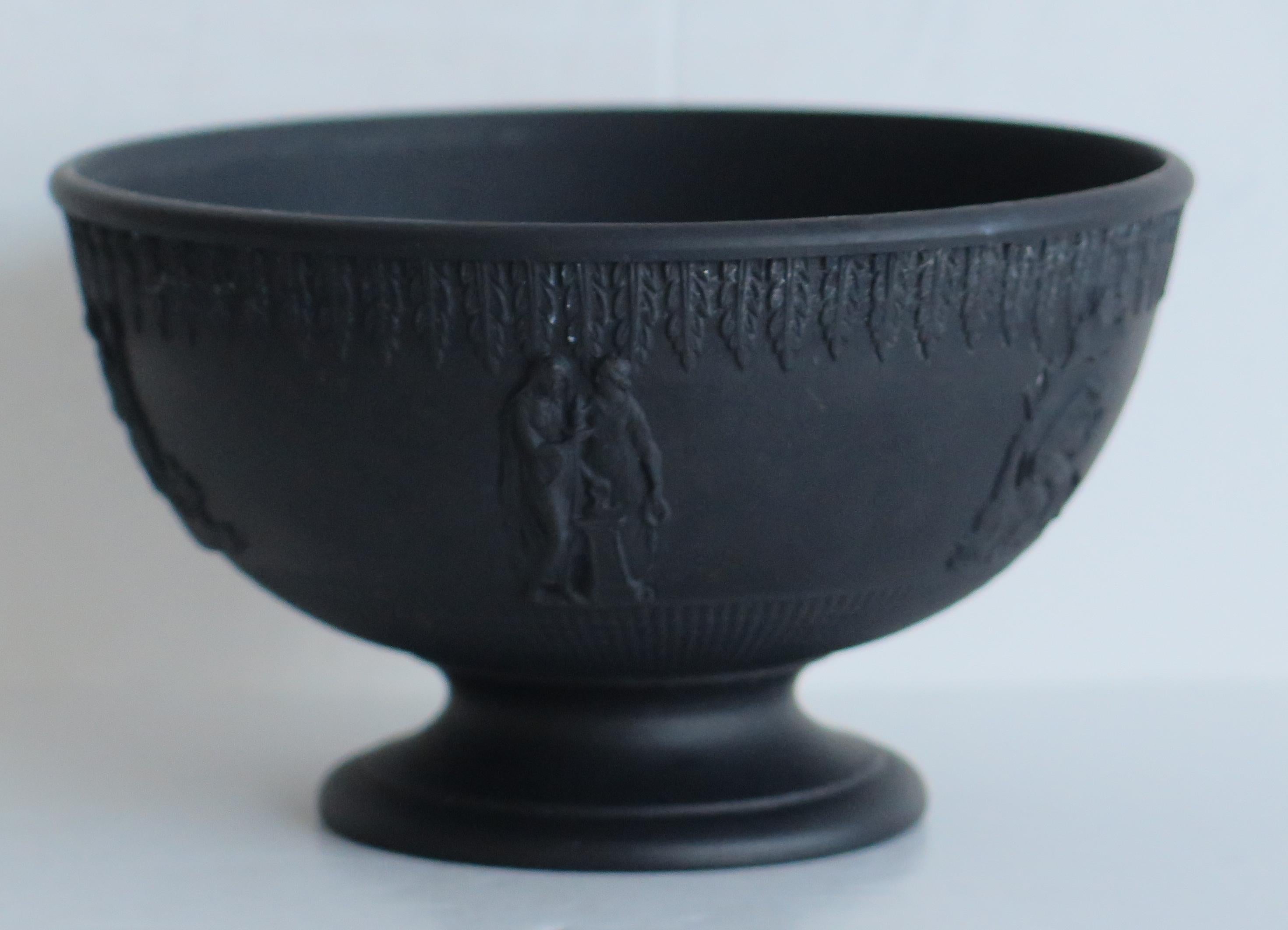 This is a very good Black Basalt Sugar Bowl which we attribute to John Turner of Lane End, Longton, Staffordshire Potteries, circa 1762 to 1806. 

The bowl has engine turned decoration as well as crisply defined classical relief mouldings around