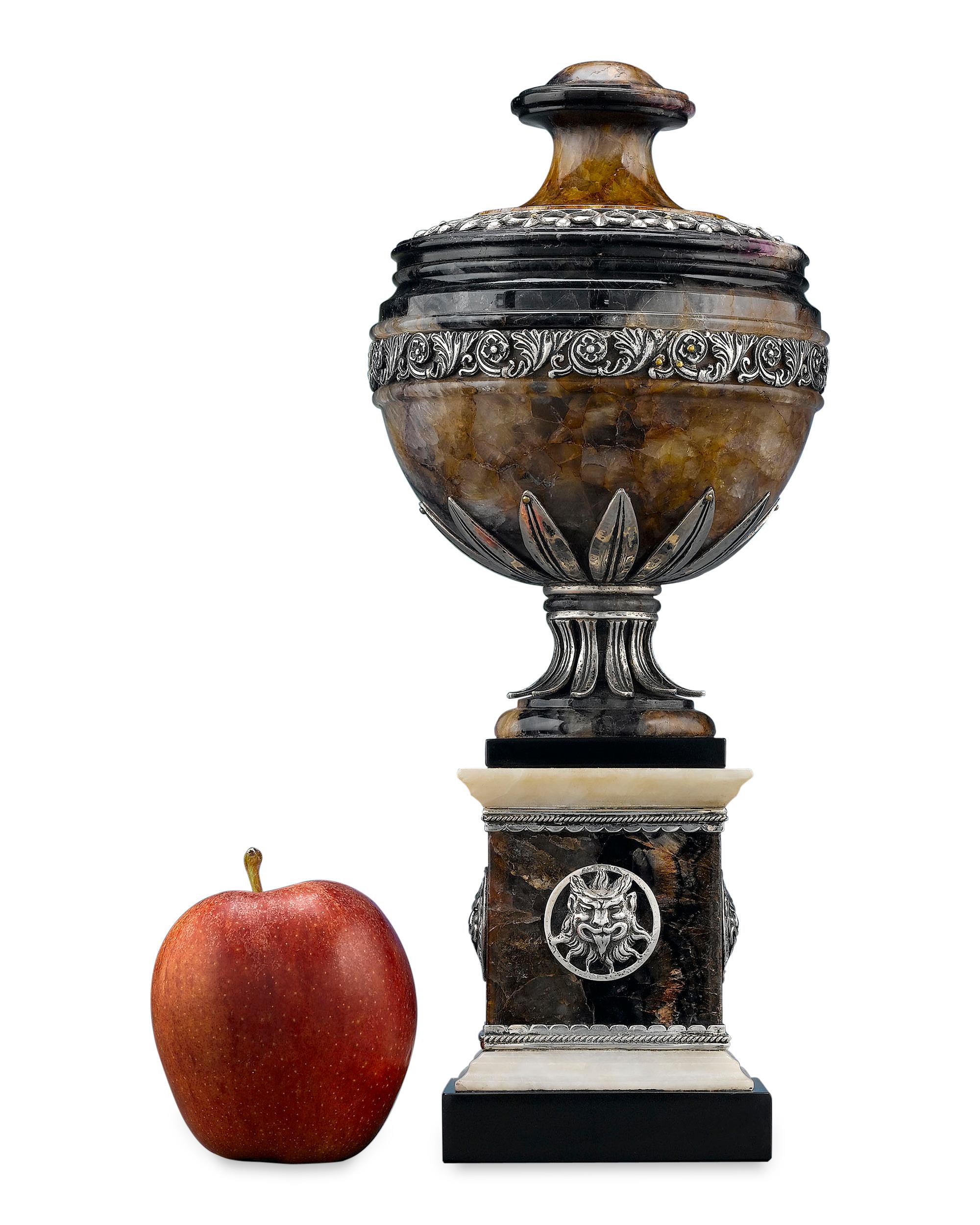 This important George III blue John urn is attributed to famed Swedish architect Sir William Chambers. The solid piece is carved entirely from rare Blue John Derbyshire spar, taken from the now-extinct Blue John Cavern in Derbyshire, England. Set