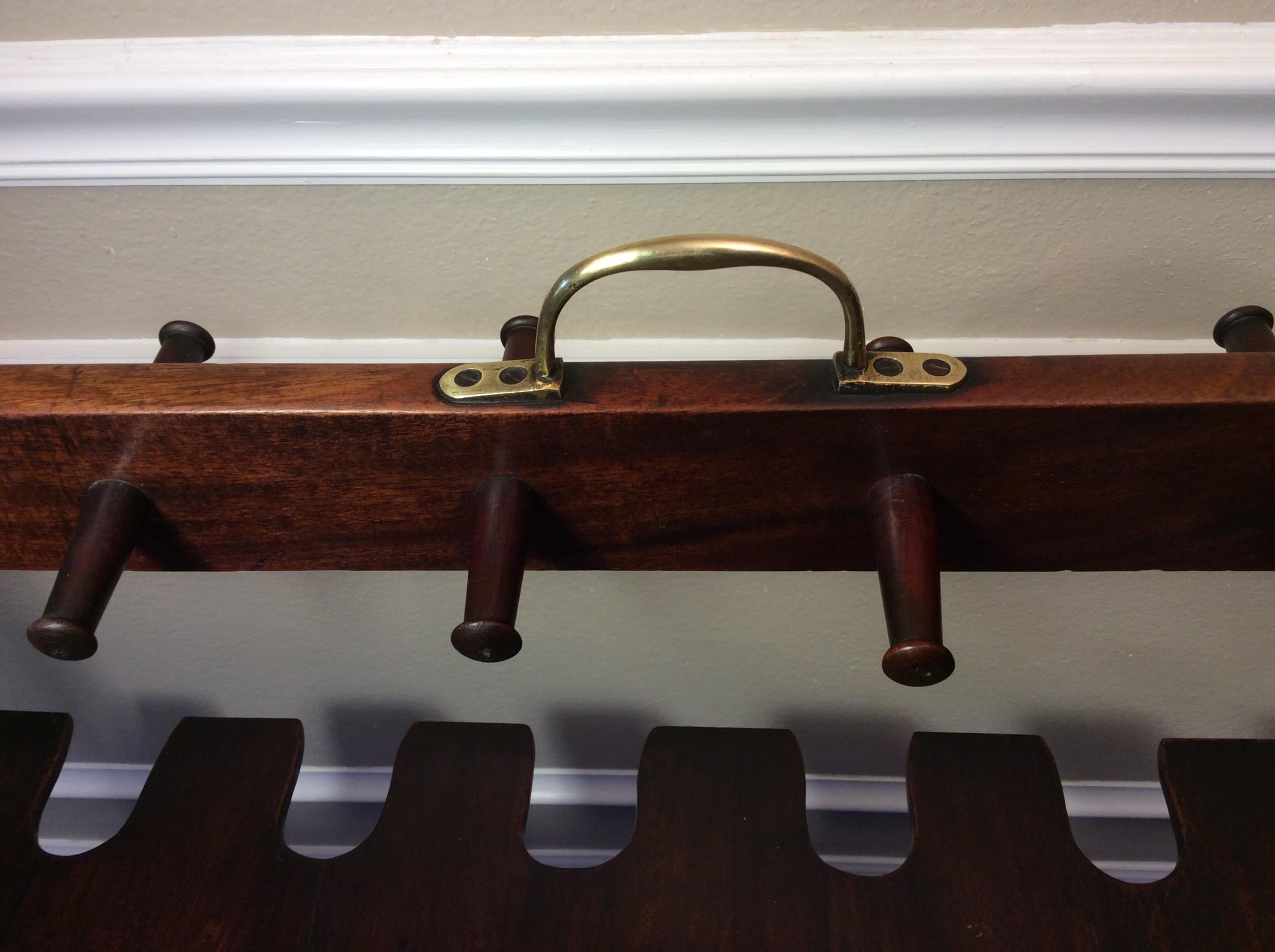 Georgian Boot Rack in excellent condition 1830-40. Retaining its original finish that appears to have only been waxed down through the years. The Mahogany has a very warm color and patina to it and it the Brass handle is original. There are a couple