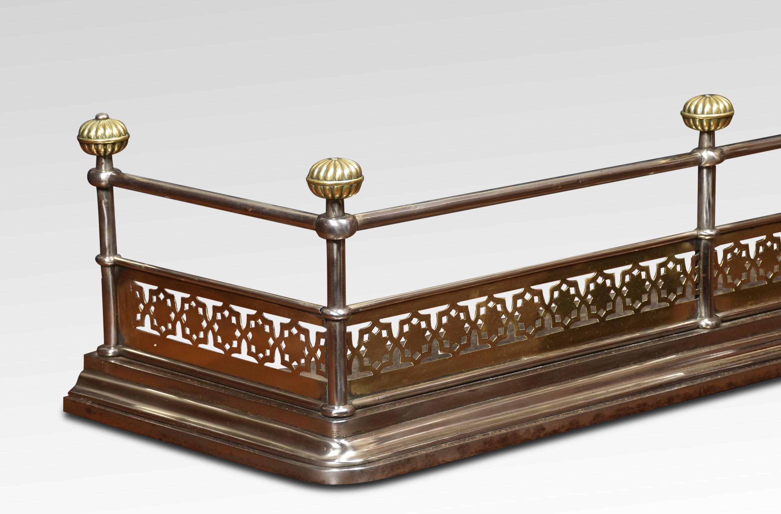 Georgian brass and polished steel fender, the steel frame with knotted finials, above pierced brass panels all raised up on moulded base.
Dimensions
Height 10.5 Inches
Width 55 Inches
Depth 14.5 Inches.