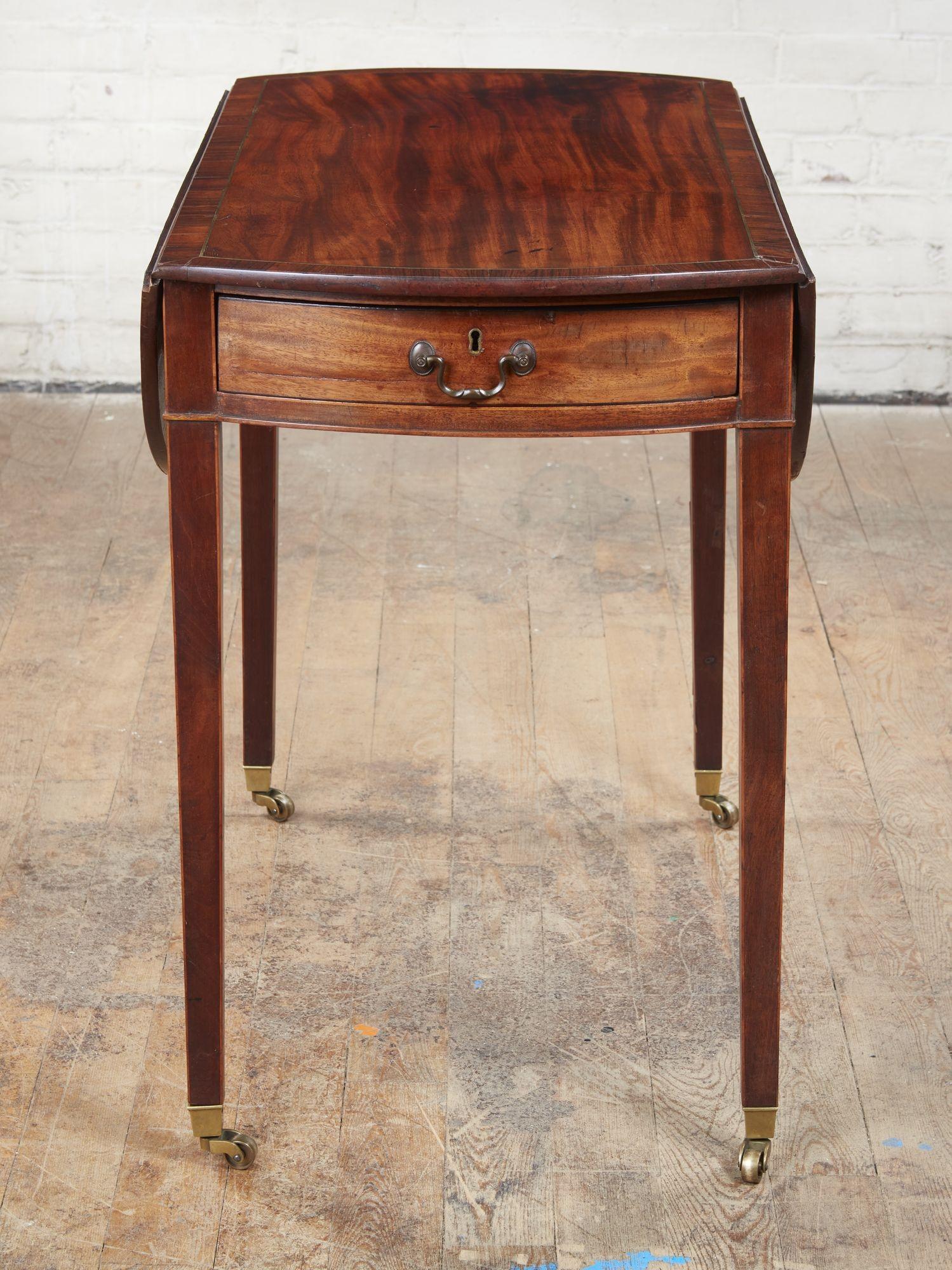 Fine George III mahogany Pembroke table with rosewood cross banding and brass string inlay, the oval top with fine graining, over single drawer with ebony sting edge inlay, retaining original swan-neck pull over square tapered legs ending in