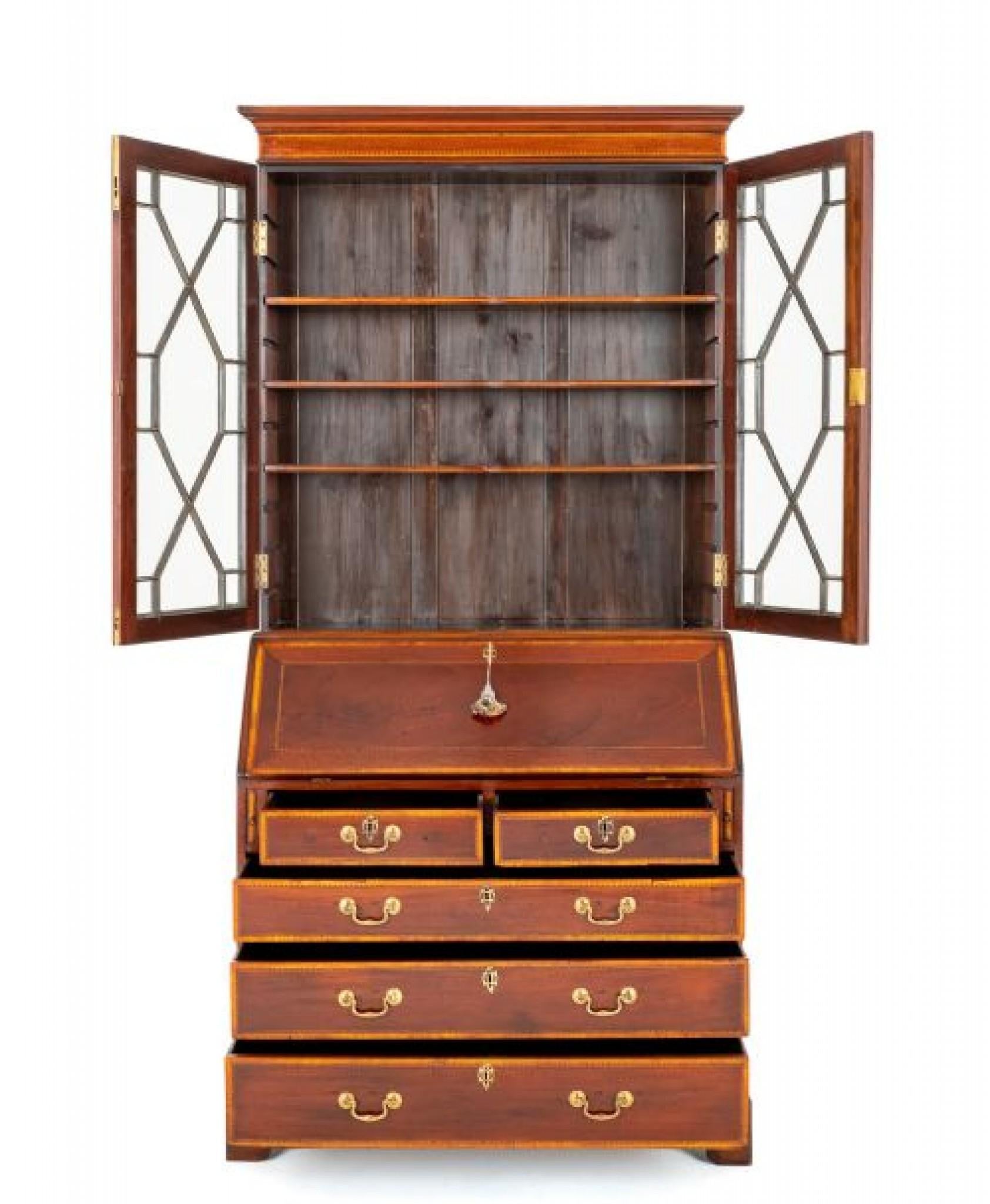 Georgian Mahogany Bureau Bookcase.
The Base Having an Arrangement of 2 Over 3 Oak Lined Drawers With Brass Swan Neck handles.
circa 1800
The Fall Opens to Reveal a Leather Writing Surface (replacement) with hand Applied Gilt and Blind Tooling and