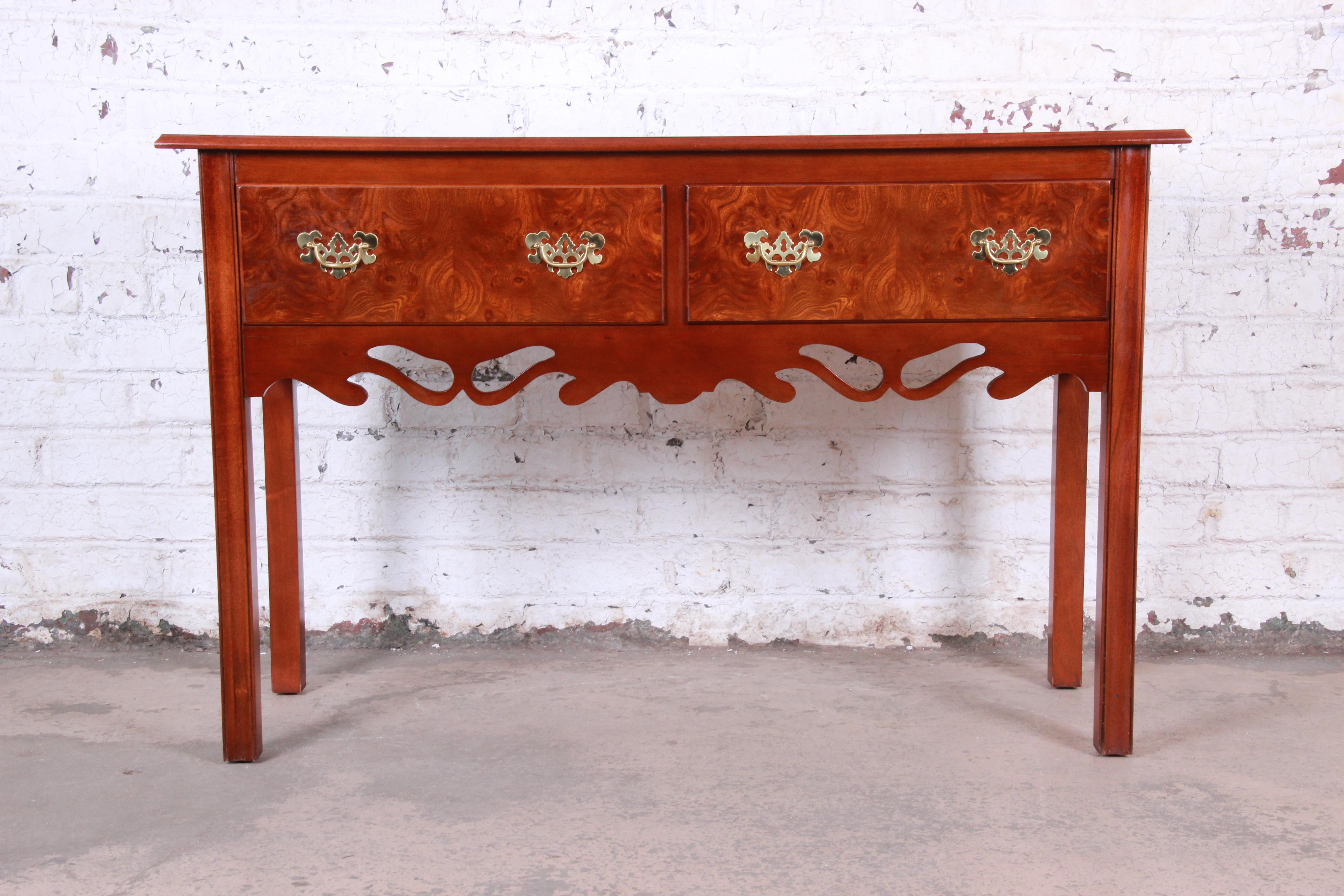 A gorgeous Georgian style mahogany and burl wood sideboard credenza or console table

Unmarked but similar in quality and construction to pieces by Baker Furniture

USA, circa 1980s

burl wood and mahogany and brass hardware

Measures: