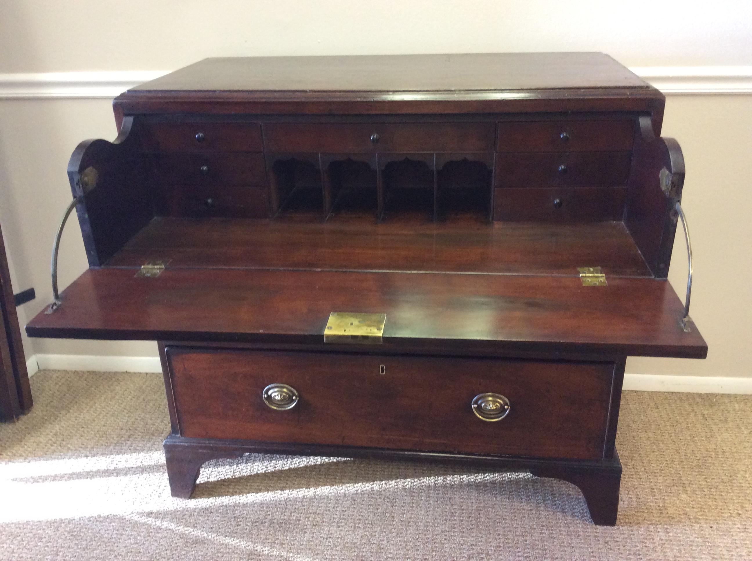 George III Mahogany Butlers Chest. Solid Mahogany molded top over three cock beaded drawers with the top drawer housing a nicely fitted desk interior. The original surface showing signs of age and use over the years and has a nice warm mellow color