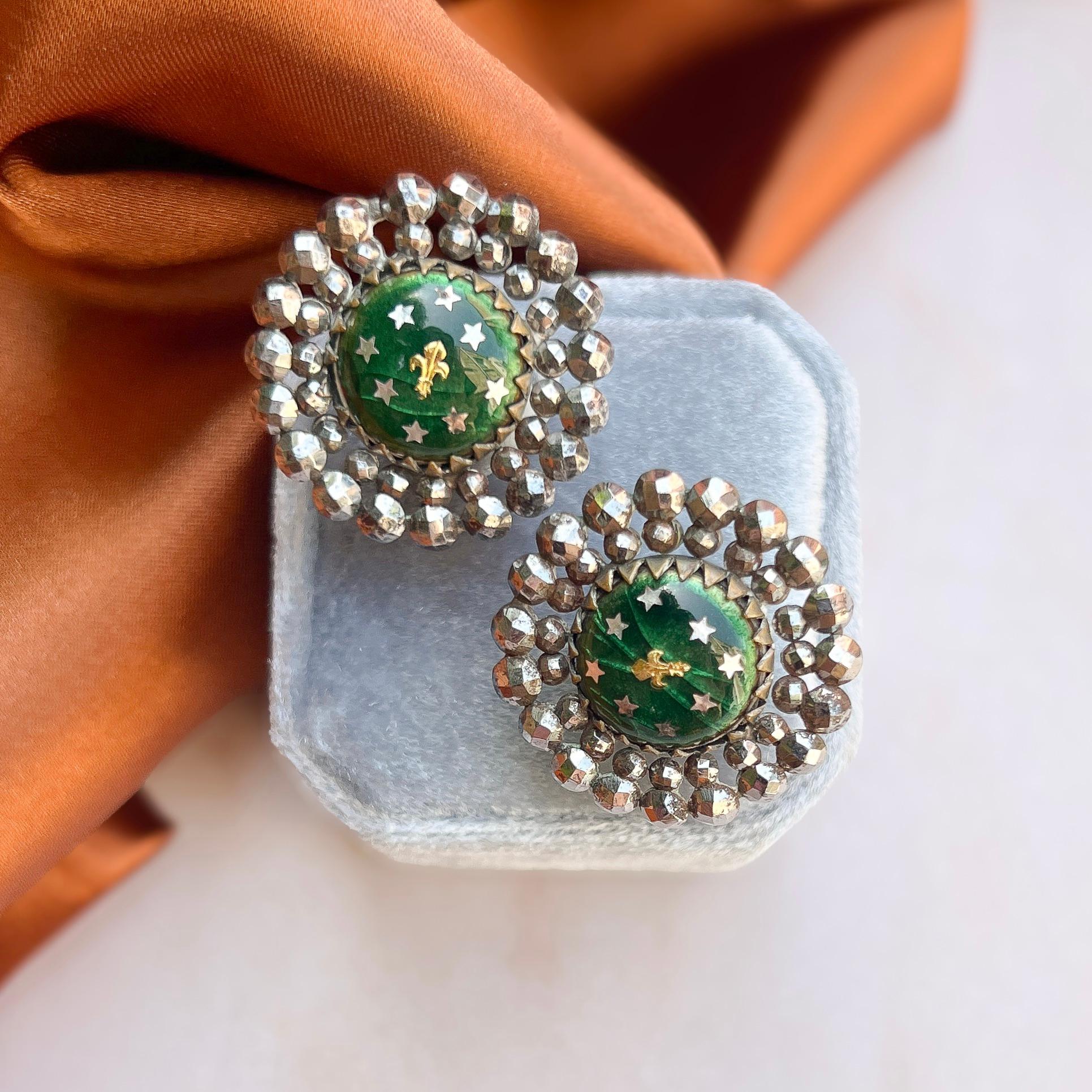 These wonderful cut steel earrings date from the Georgian era and were originally buttons. 

Condition Report:
Very Good - One claw on the setting in the centre of the earring is slightly bent. This is only apparent upon very close inspection and