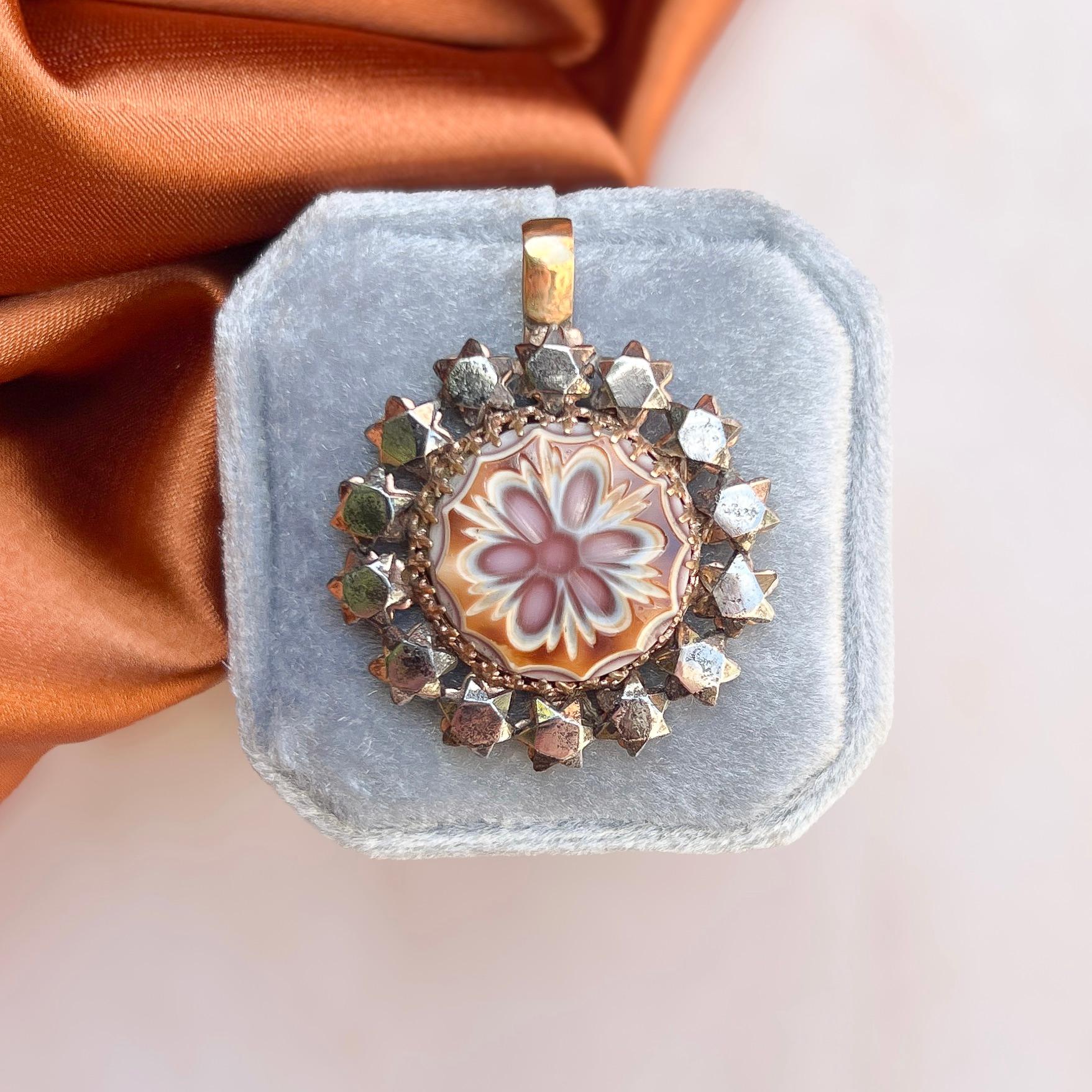 This beautiful cut steel pendant dates from the Georgian era.

Condition Report:
Excellent

The Details...
This pendant was made in the Georgian era. It was perhaps originally a button and was converted into a pendant in the late 1800s to early