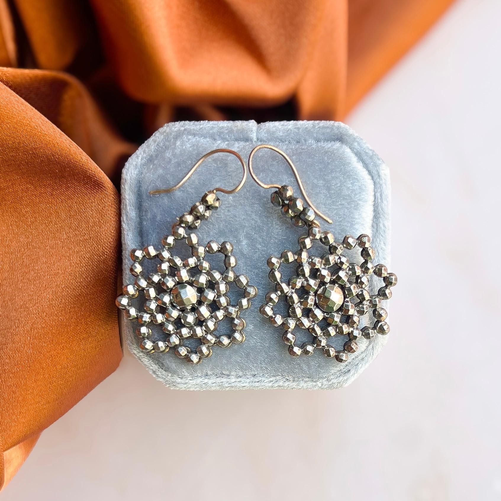These wonderful cut steel earrings date from the Georgian era and feature an elegant floral motif. 

Condition Report:
Excellent

The Details...
These earrings were made in the Georgian era. They feature multi-faceted cut steel studs, assembled onto