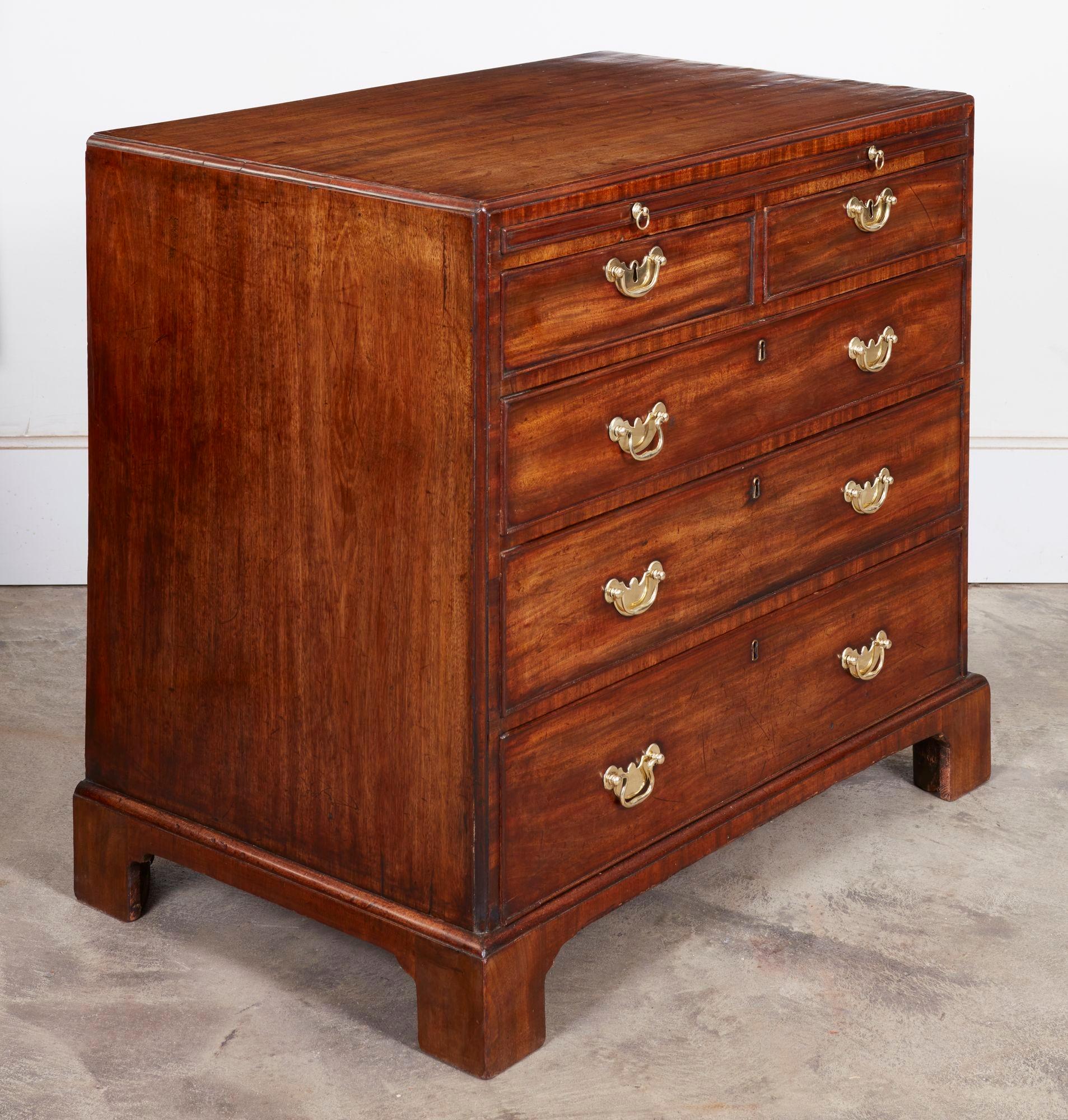 Very fine George III mahogany caddy top bachelors chest attributed to Giles Grendey, having a bead molded top over brushing slide over two short and three long graduated drawers, all boasting original brass hardware, and standing on well formed