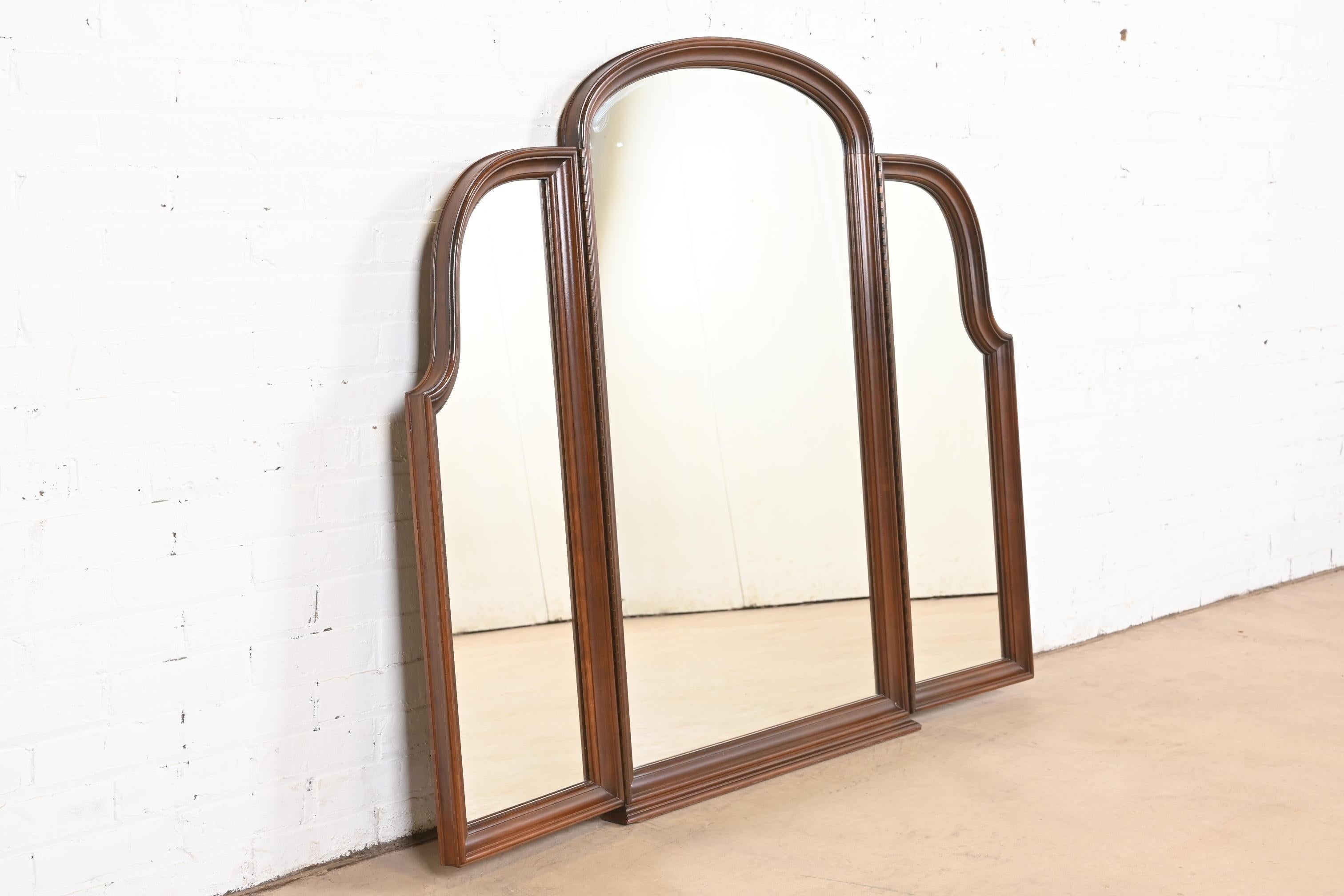 A gorgeous Georgian or Chippendale style carved cherry wood framed tri-fold triple mirror

USA, Circa 1980s

Measures: 42