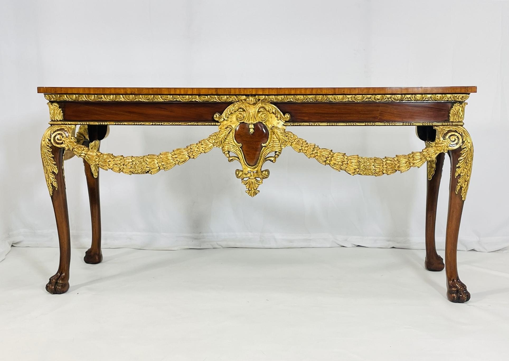 Elevate your decor with this exquisite Georgian Carved & Gold Gilt Mahogany Console Table by Maitland Smith. Crafted with intricate detailing and a luxurious gold gilt finish, this table exudes elegance and sophistication. The rich mahogany wood