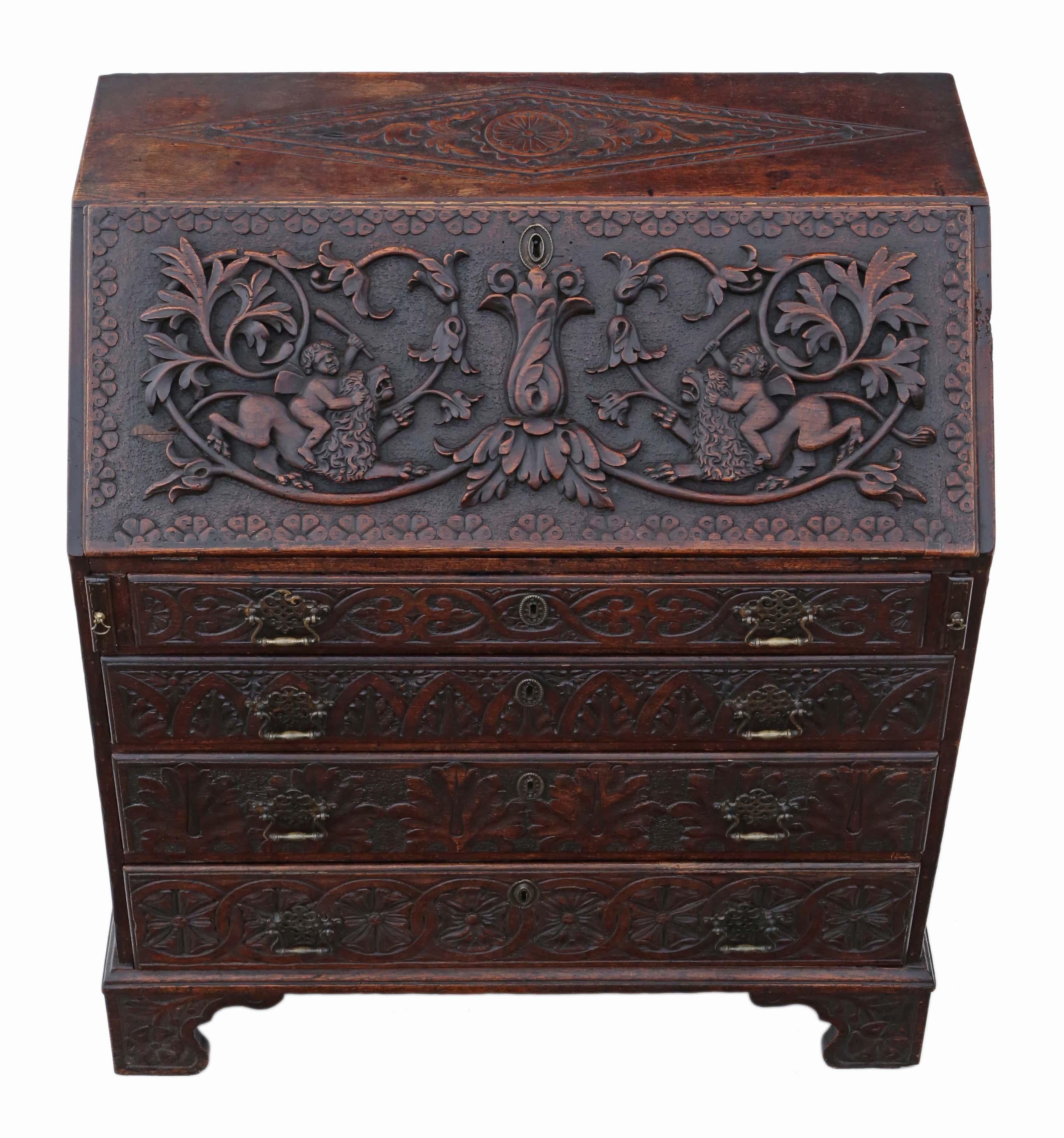 Antique Georgian, circa 1800 and later carved oak bureau desk writing table.

This is a lovely quality bureau, that is full of age, charm and character. Fantastically detailed carving, so much work went into this!

No loose joints and the