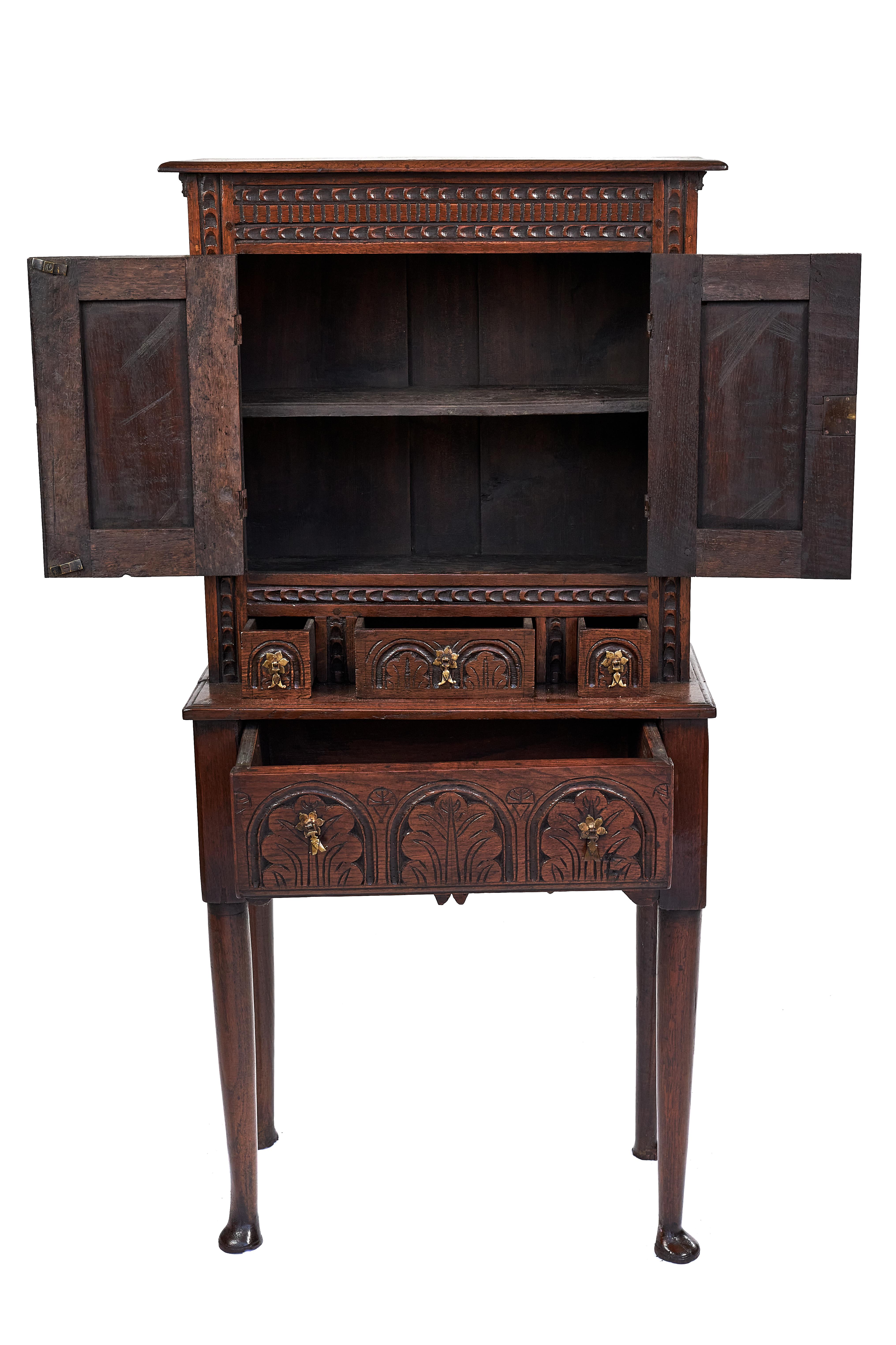 Georgian oak cupboard lowboy having two doors with inset panel which open to reveal a single shelf interior. Three small drawers above one large drawer all with lovely original brass split tail drop handles and original working lock and key. It is