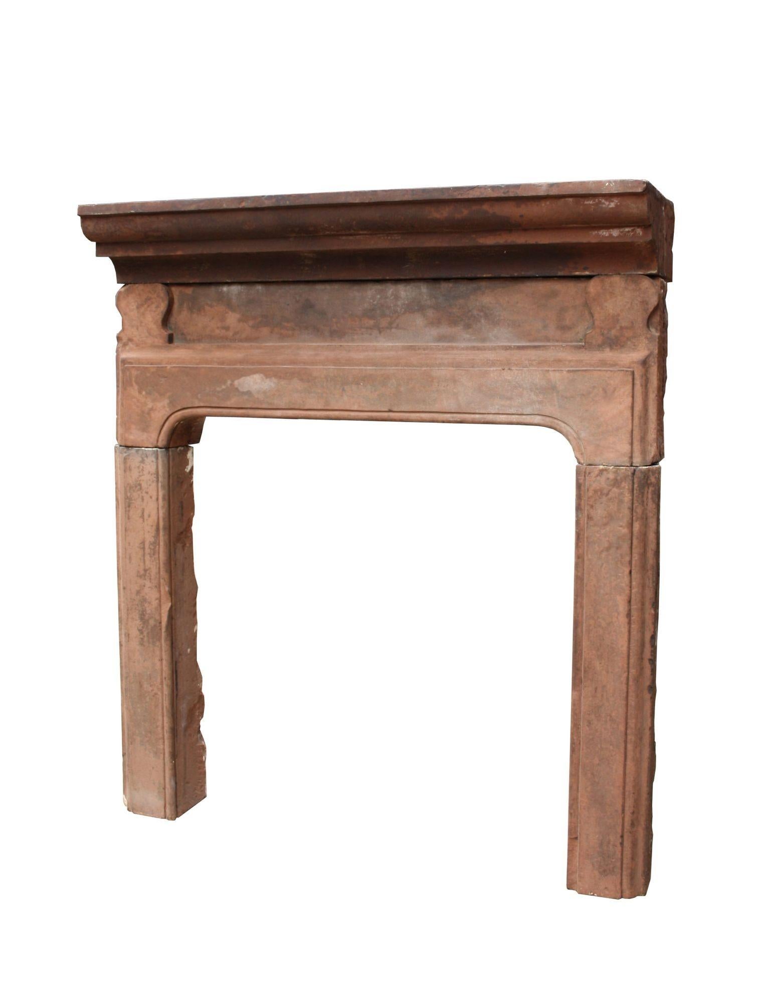 A mid 18th century English chimneypiece, carved from red sandstone. This fire mantel was salvaged from a farmhouse in the peak district.

Opening Height 98 cm (38.58 in)
Opening Width 96 cm (37.79 in)