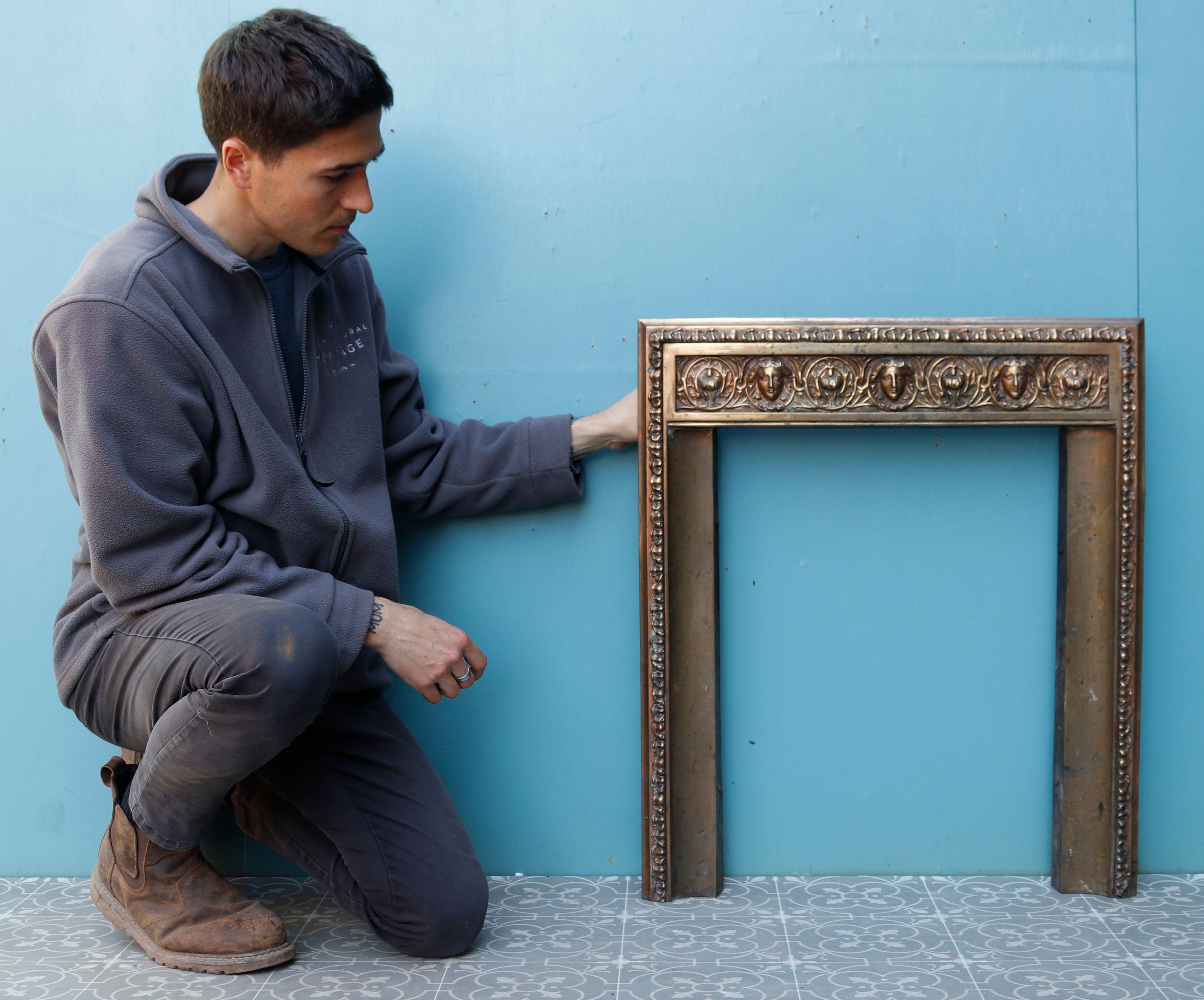 Georgian cast brass fireplace insert. A brass fire insert, in the Georgian style of the late 18th century, incorporating very decorative, George III motifs and foliage around the frieze and jambs.

Additional Dimensions

Opening height 61.5