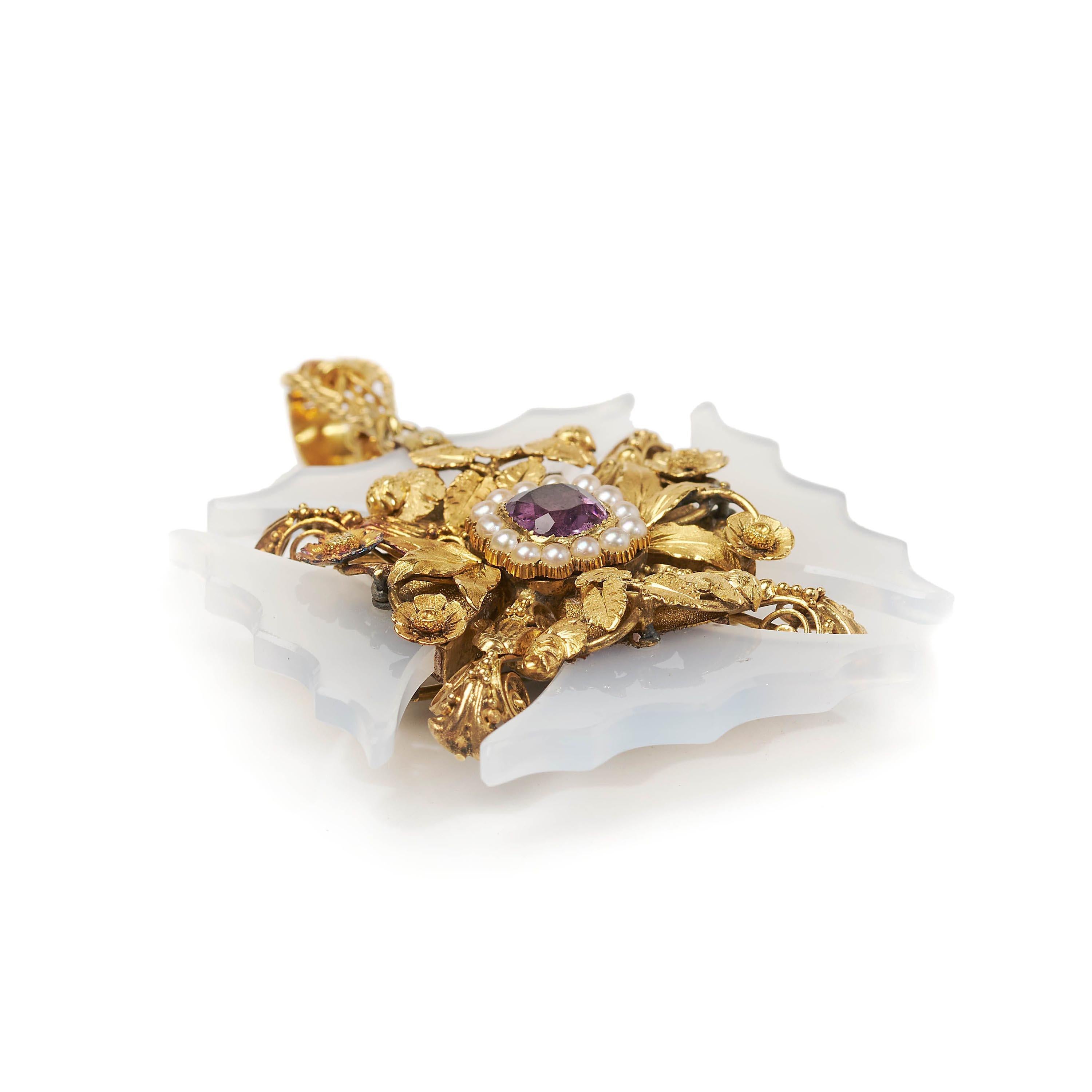A Georgian cross pattée, with a faceted, cushion shaped amethyst, set in the centre, with a cluster surround of natural half seed pearls, in cut down style settings, in a delicate, silver gilt and 15ct gold mount, of individual flowers, leaves,