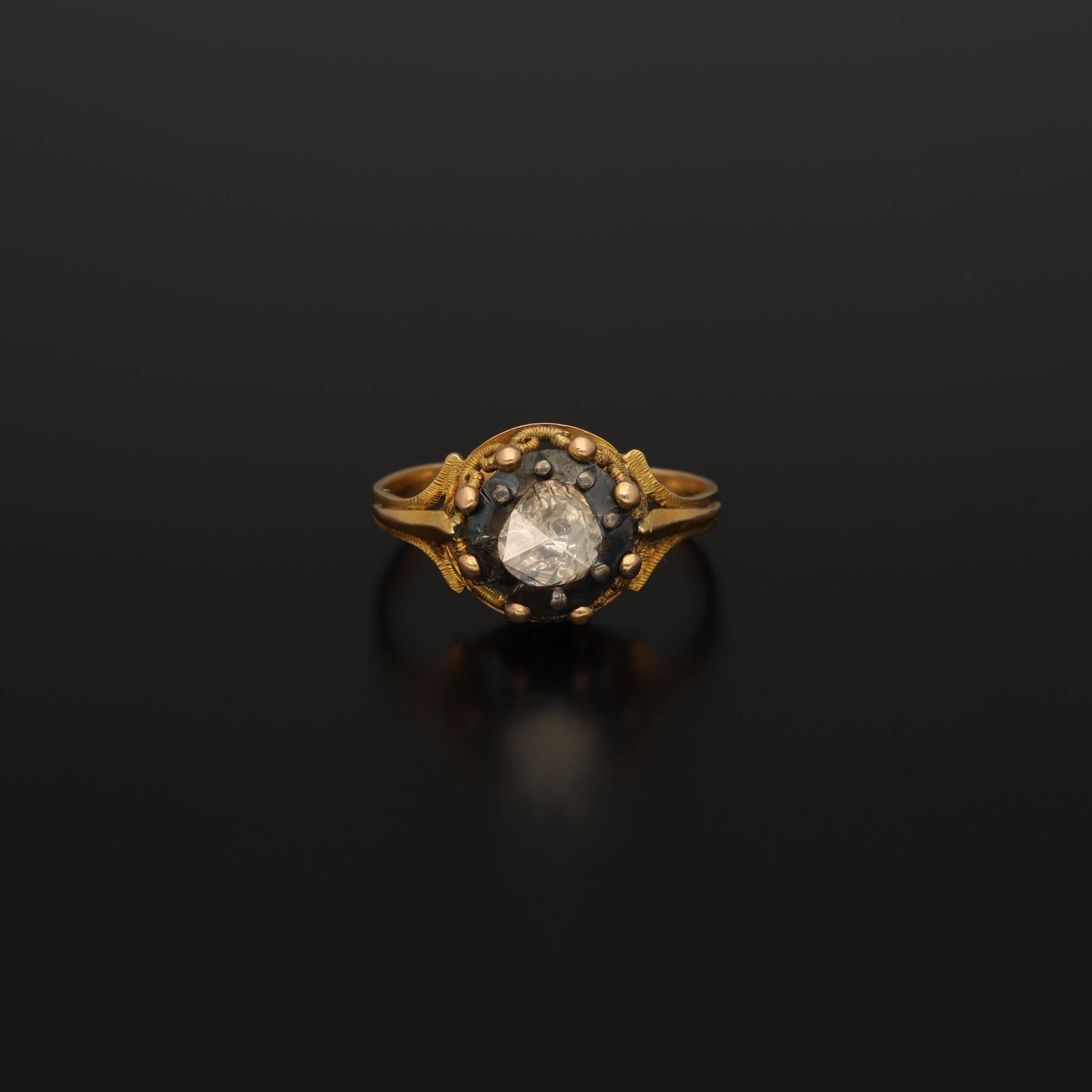 An absolutely incredible antique Georgian era diamond solitaire ring!

This 300 years old ring ring boasts a stunning highly elevated crown set with a HUGE sparkling diamond of circa 1 carat. The diamond is set on silver and foiled on its nest to