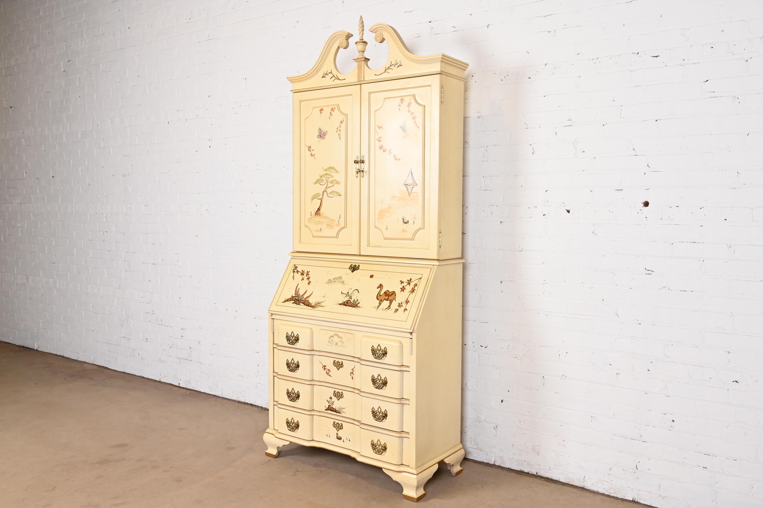 A gorgeous Georgian Chinoiserie style bureau with drop front secretary desk and bookcase hutch top

By Jasper Cabinet Co.

USA, Circa 1970s

Cream lacquered walnut, with hand-painted Asian scenes, and original brass hardware. Desk locks, and