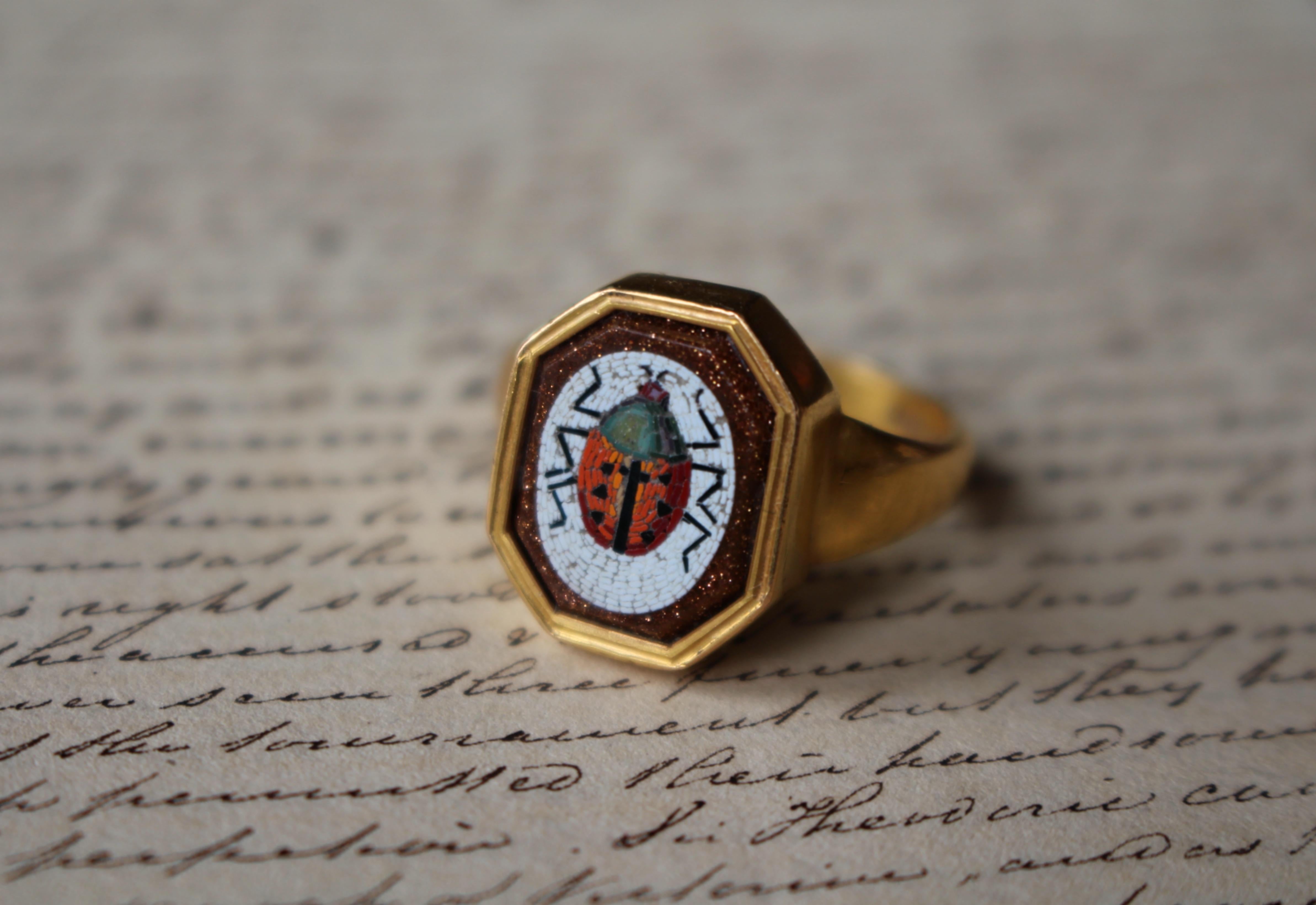 Georgian micro mosaic, late eighteenth century circa 1790, finely modelled as a ladybird, set into an octagonal goldstone.

The gold mount echoes the octagonal shape of the goldstone and is crafted in 22 carat gold (and hallmarked) and made