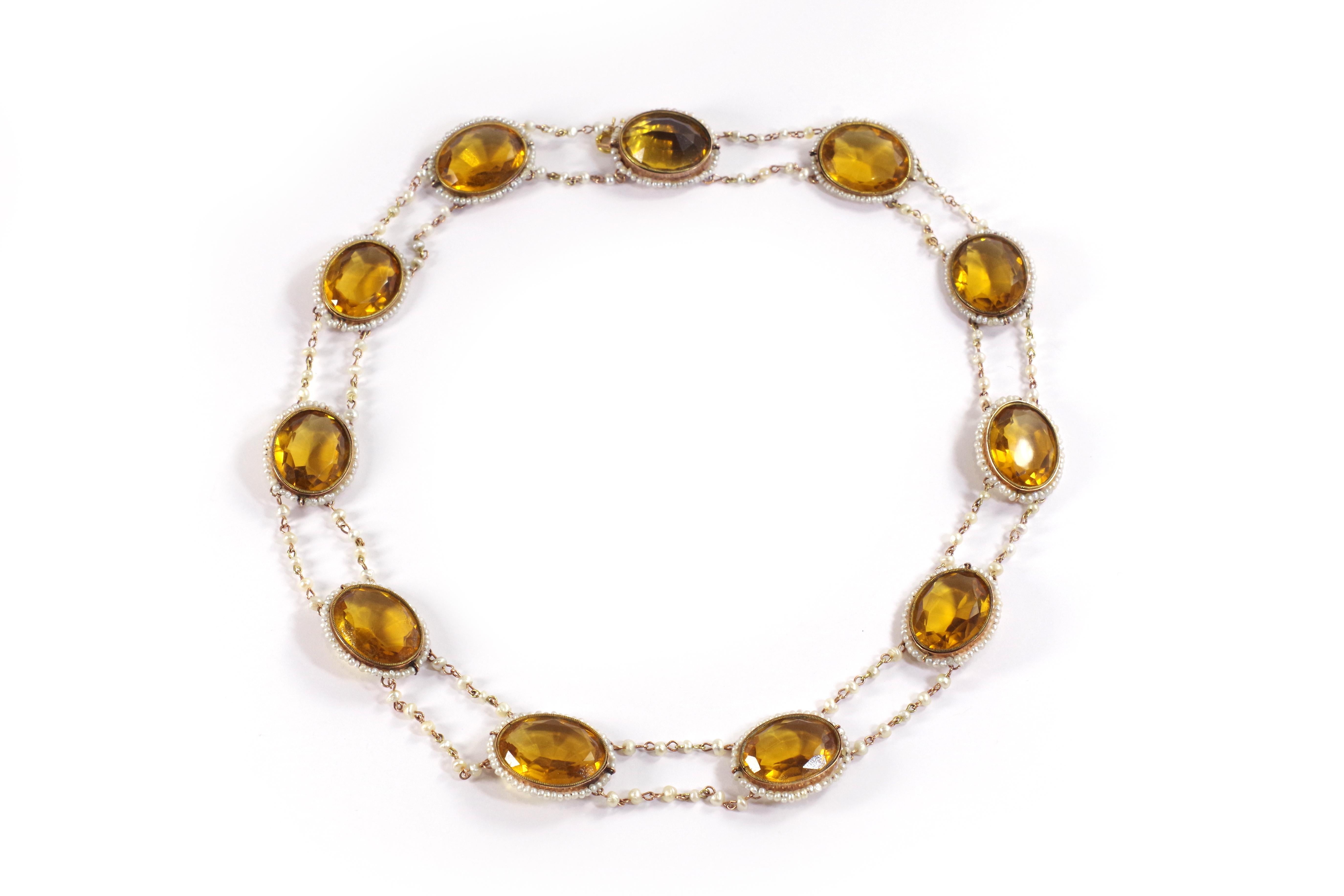 Georgian citrine paste seed pearl necklace in rose gold 9 karats. Rare necklace dating from the 1st Empire (Napoleon Ist, circa 1810) composed of eleven faceted oval glasses imitating citrine, in closed gold settings surrounded by lines of small