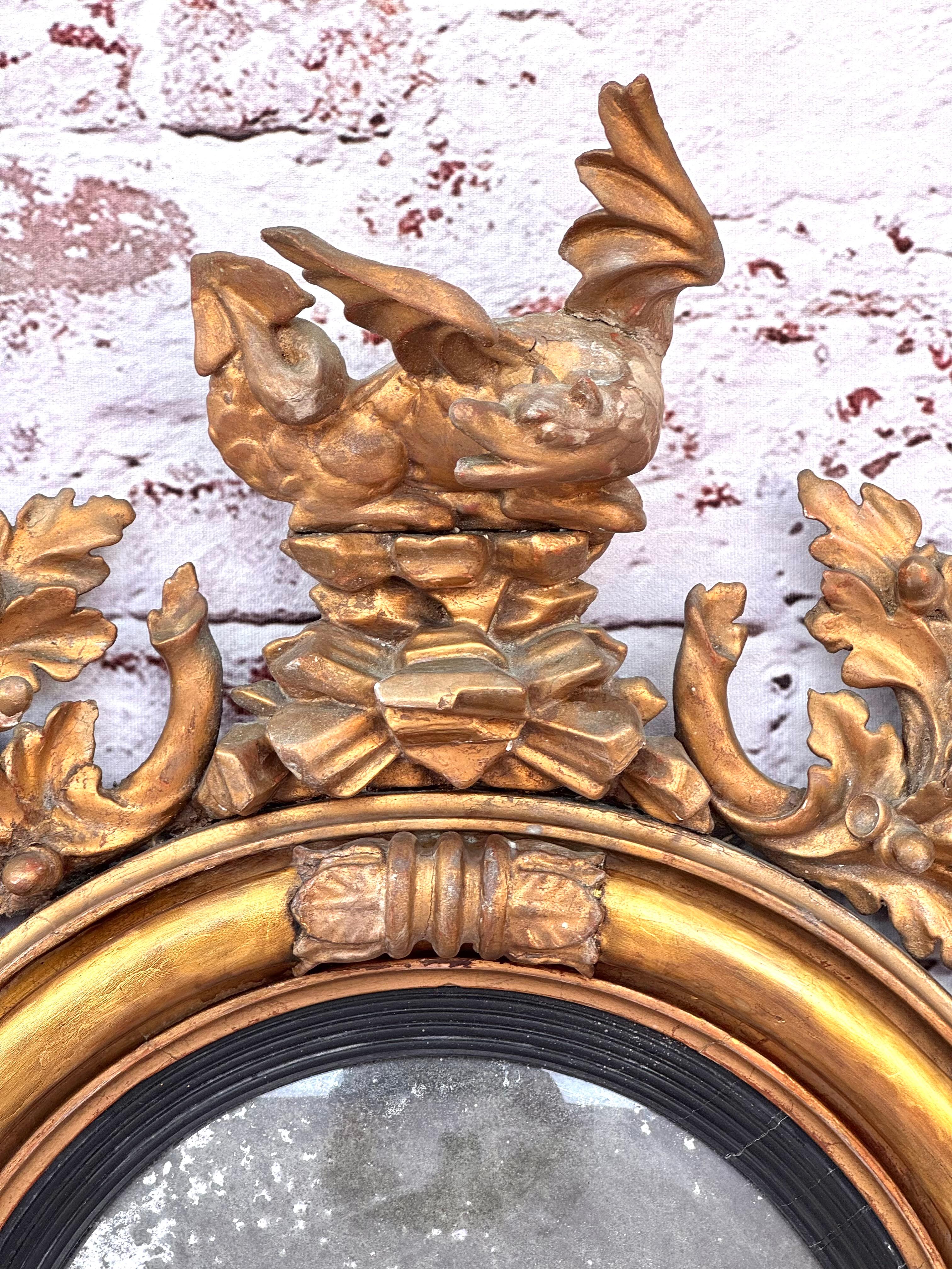 English Georgian Convex Giltwood Bullseye Mirror with a Dragon For Sale