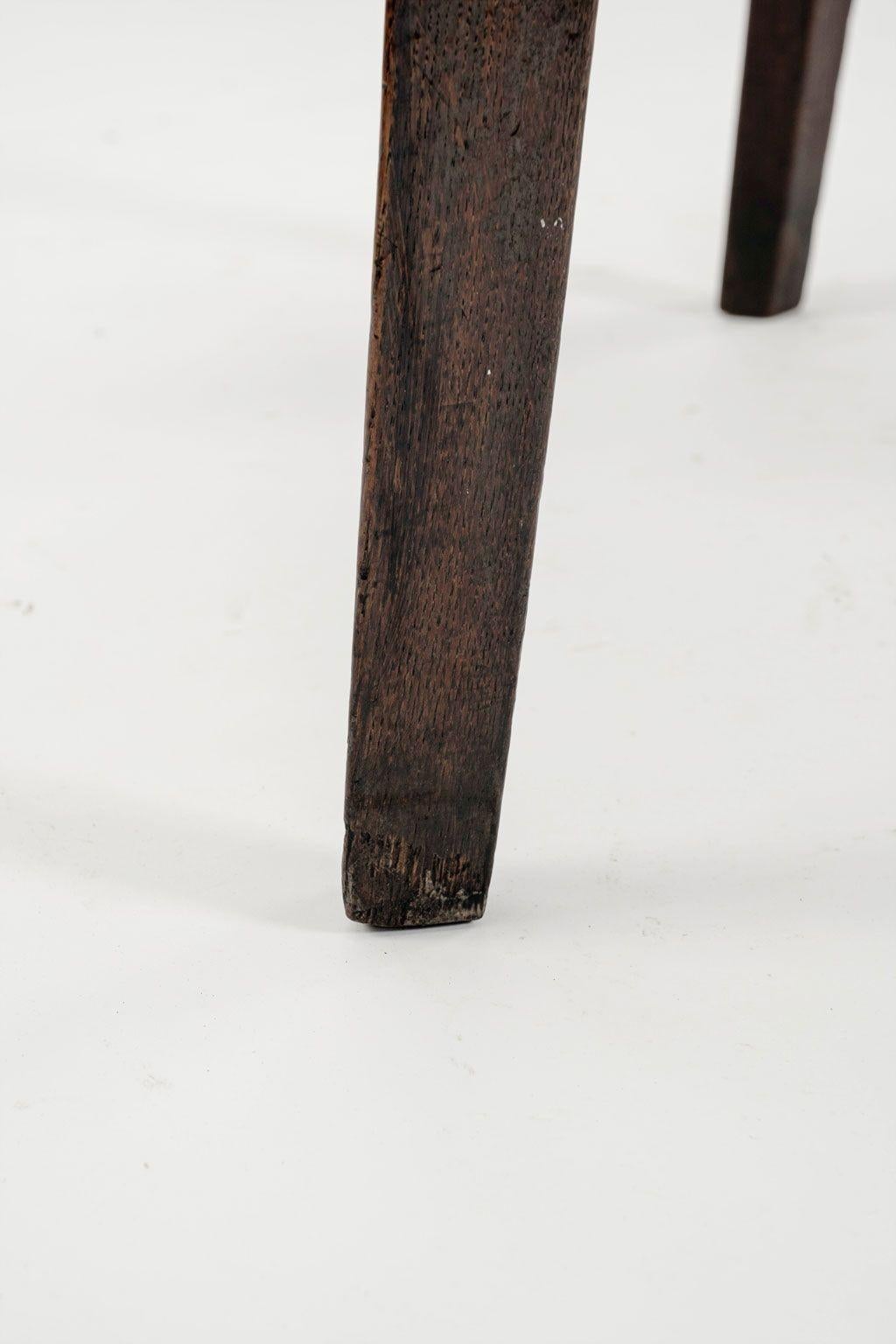 Georgian cricket table in oak on simple tapered legs. Dates to late 18th century. Hand-carved with mortise and tenon construction.

Note: Regional differences in humidity and climate during shipping may cause antique and vintage wood to shrink