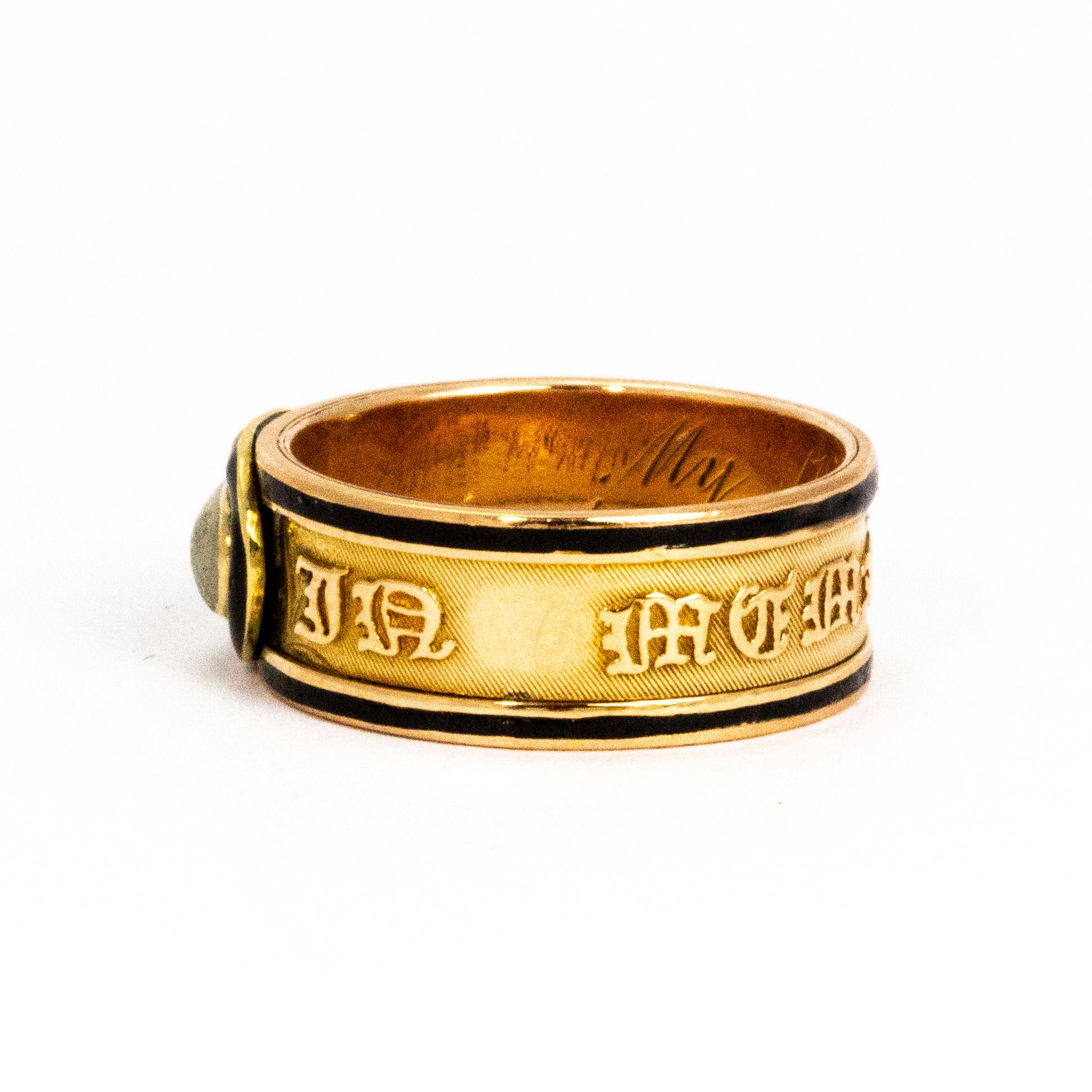 This memorial band is a wonderful example of a Georgian piece of jewellery. The man detail in this ring is the crystal cabochon set into the 18 carat gold band and the black enamel that circles the stone and all the way around the band. The outside