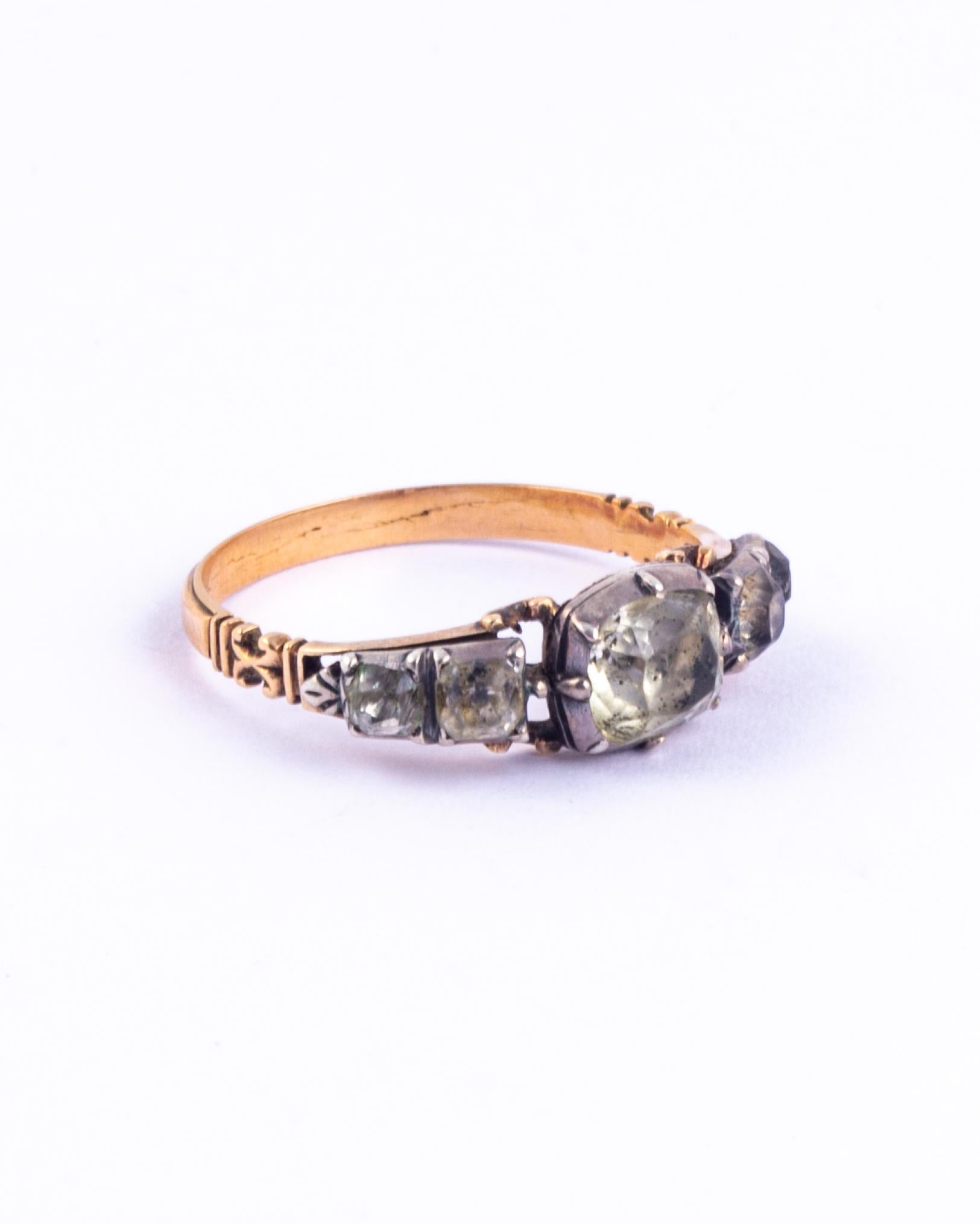 A very fine Georgian ring set with five stunning graduated crystals. Modelled in 15 carat yellow gold. Dated to 1750. The shoulders have detail below the crystals and the underside of the stones is pretty fabulous also!

Ring Size: P 1/2 or 8