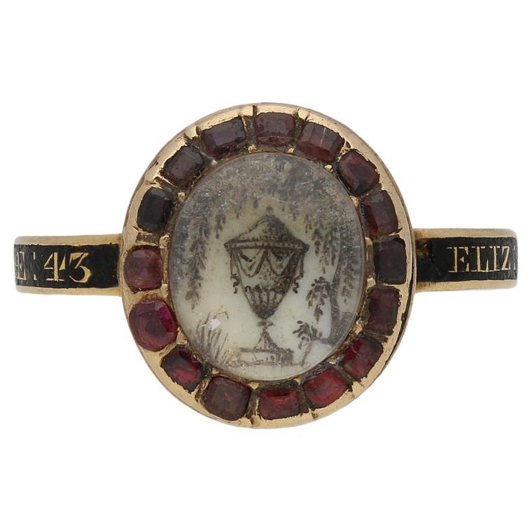 Georgian crystal, garnet and enamel memorial ring, English, circa 1775.