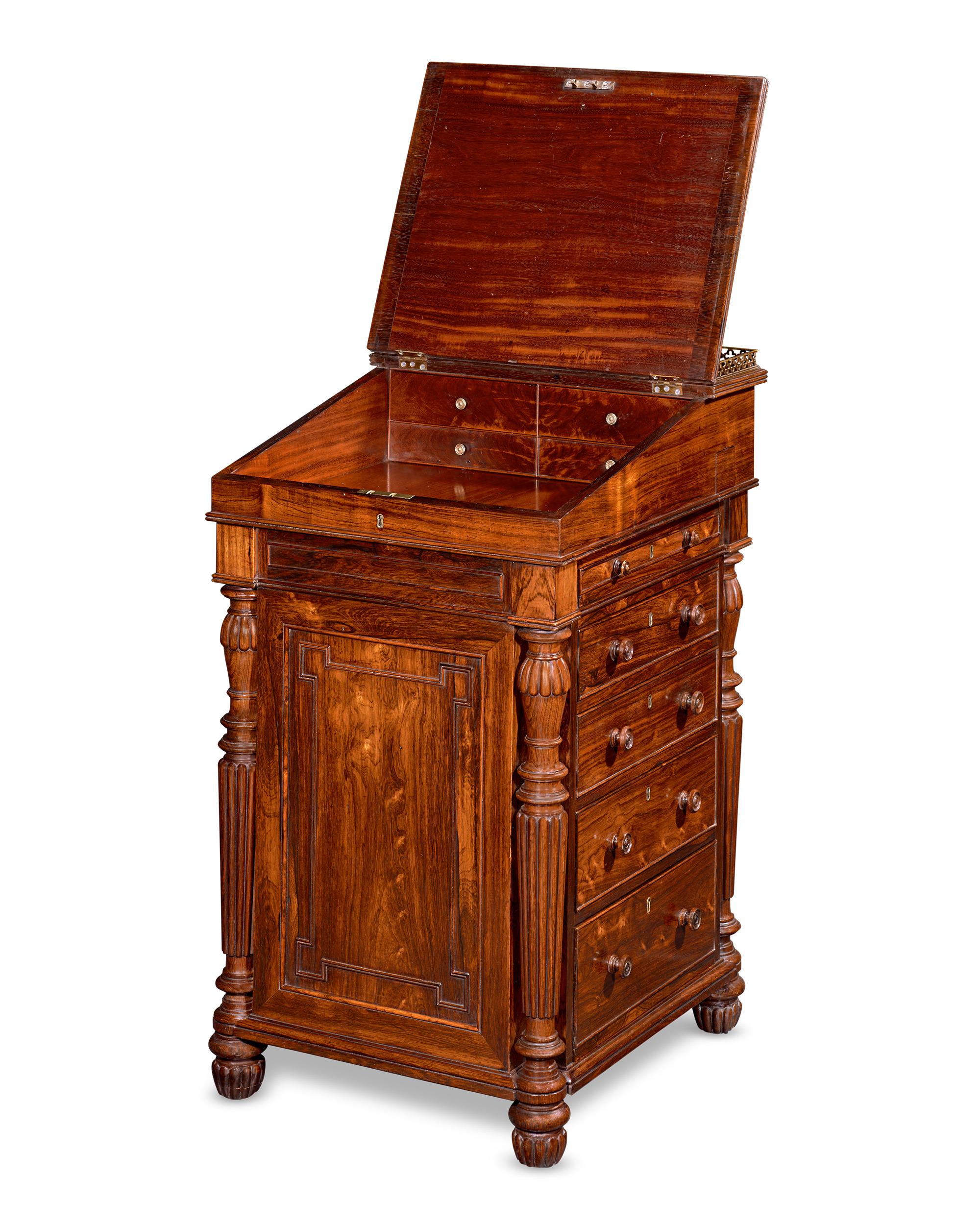 There is more to this exceptional George IV Davenport desk than meets the eye. Attributed to famed cabinetmaker Gillows of Lancaster and London and crafted of luxurious rosewood, the 19th-century desk is compact yet offers ample storage space.