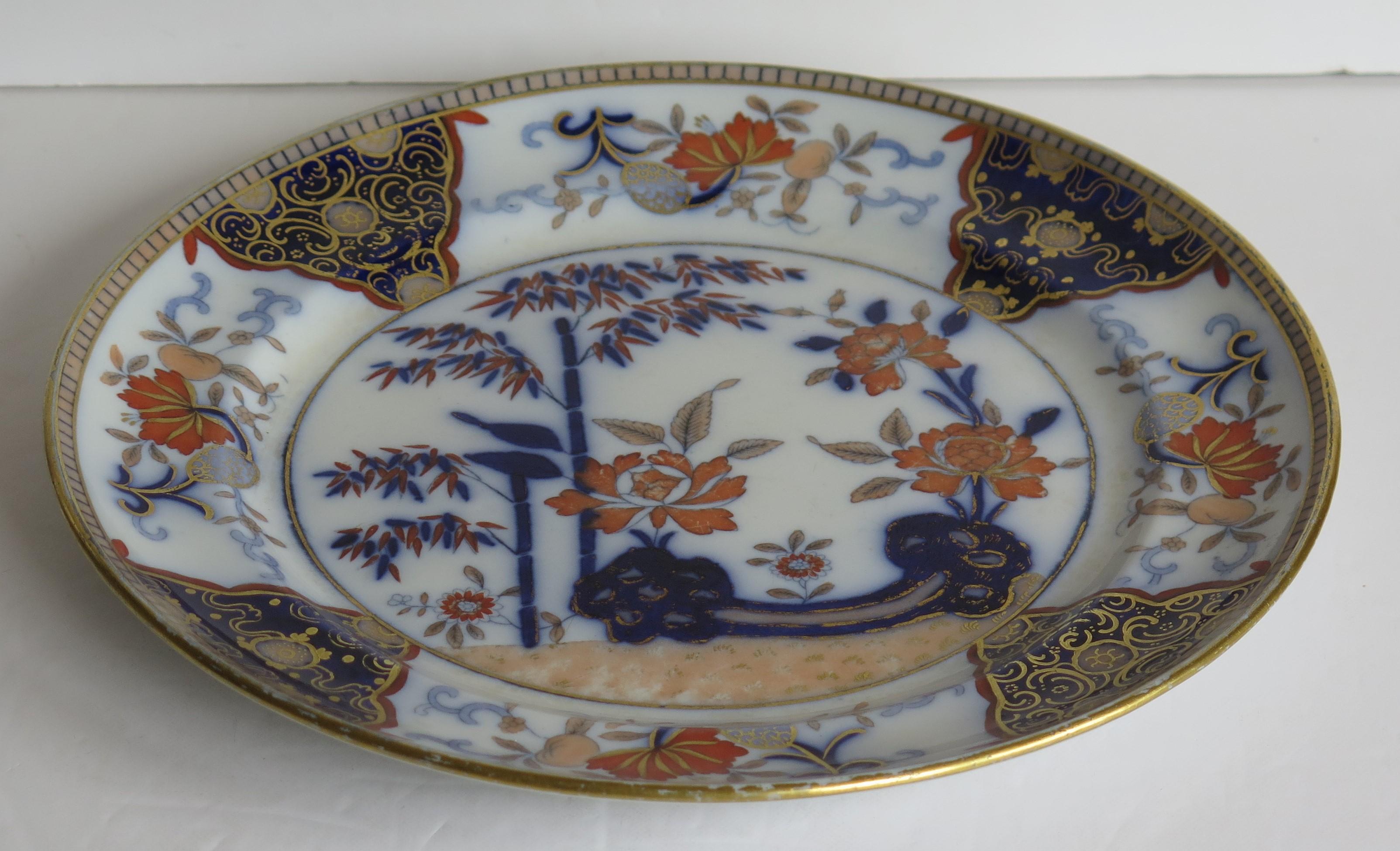 This a good large dinner plate made by William Davenport & Co., Longport, Staffordshire Potteries, England, circa 1810-1820.

The plate is hand painted over a printed outline in a bold Chinoiserie pattern No. 135. The design highlights a bamboo