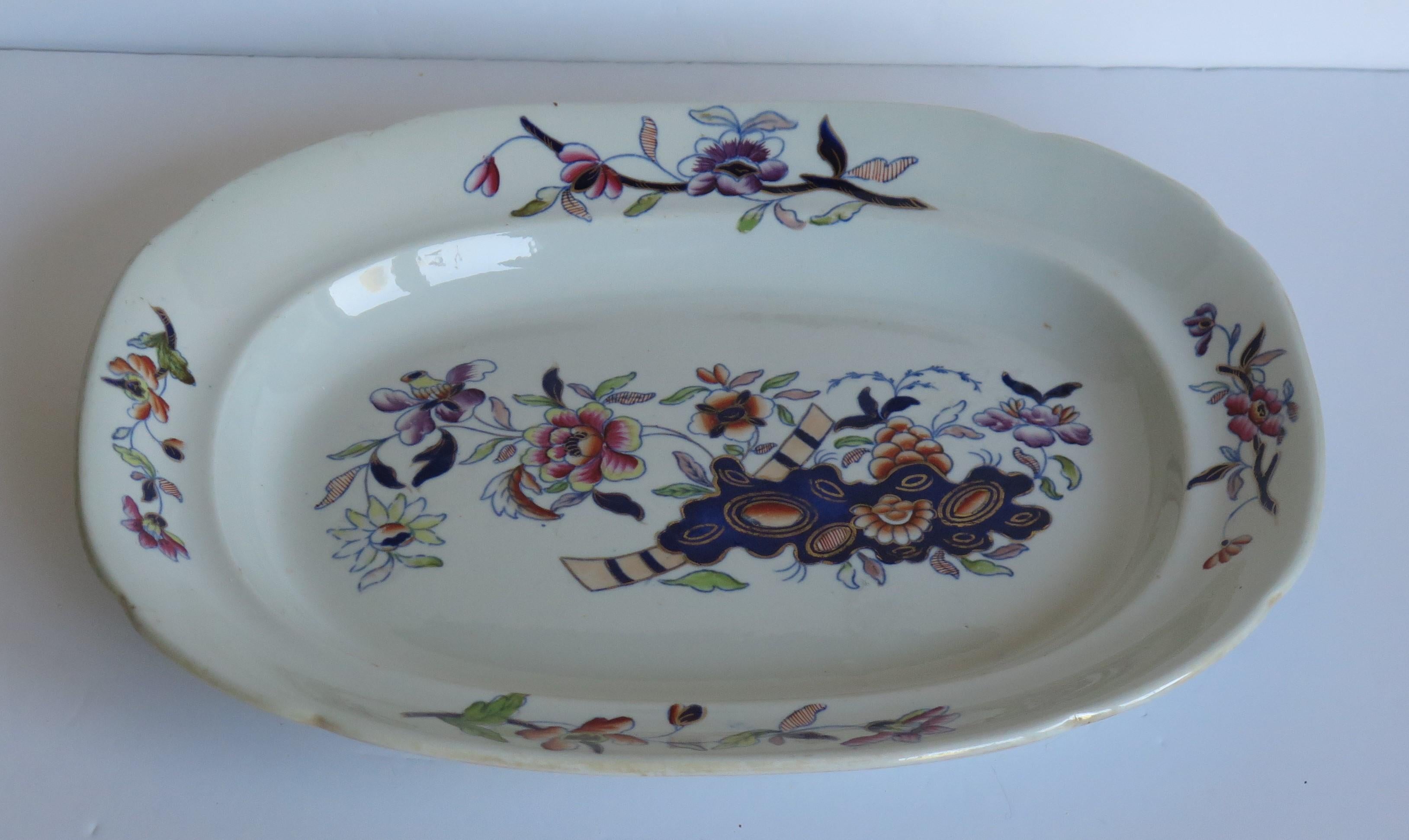 This is a good early hand painted ironstone (stone china) platter or serving dish, made by William Davenport and Co., Longport, Staffordshire Potteries, England, George 111rd period, circa 1815.

The pattern is number 