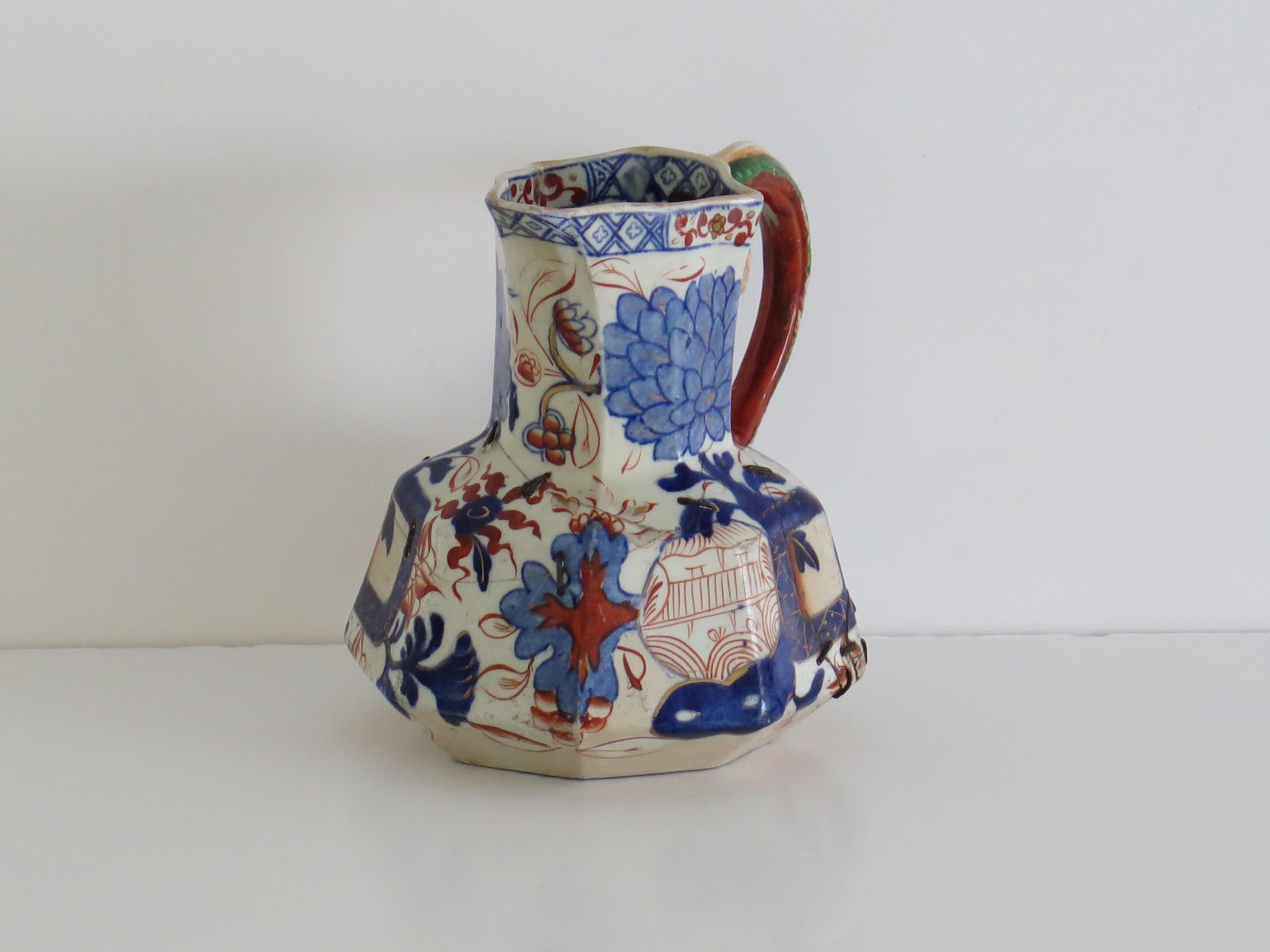 This is a mid size repaired Hydra jug or Pitcher made by the Davenport Company of Longport, Staffordshire, England in the late Georgian period, circa 1805-1820, made of Ironstone pottery, which Davenport called Stone China.

It is hand decorated
