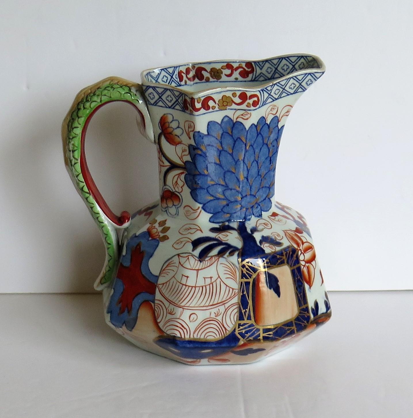 This is a very good mid to large size Hydra jug or Pitcher made by the Davenport Company of Longport, Staffordshire, England in the late Georgian period, circa 1805-1820, made of Ironstone pottery, which Davenport called Stone China.

It is hand