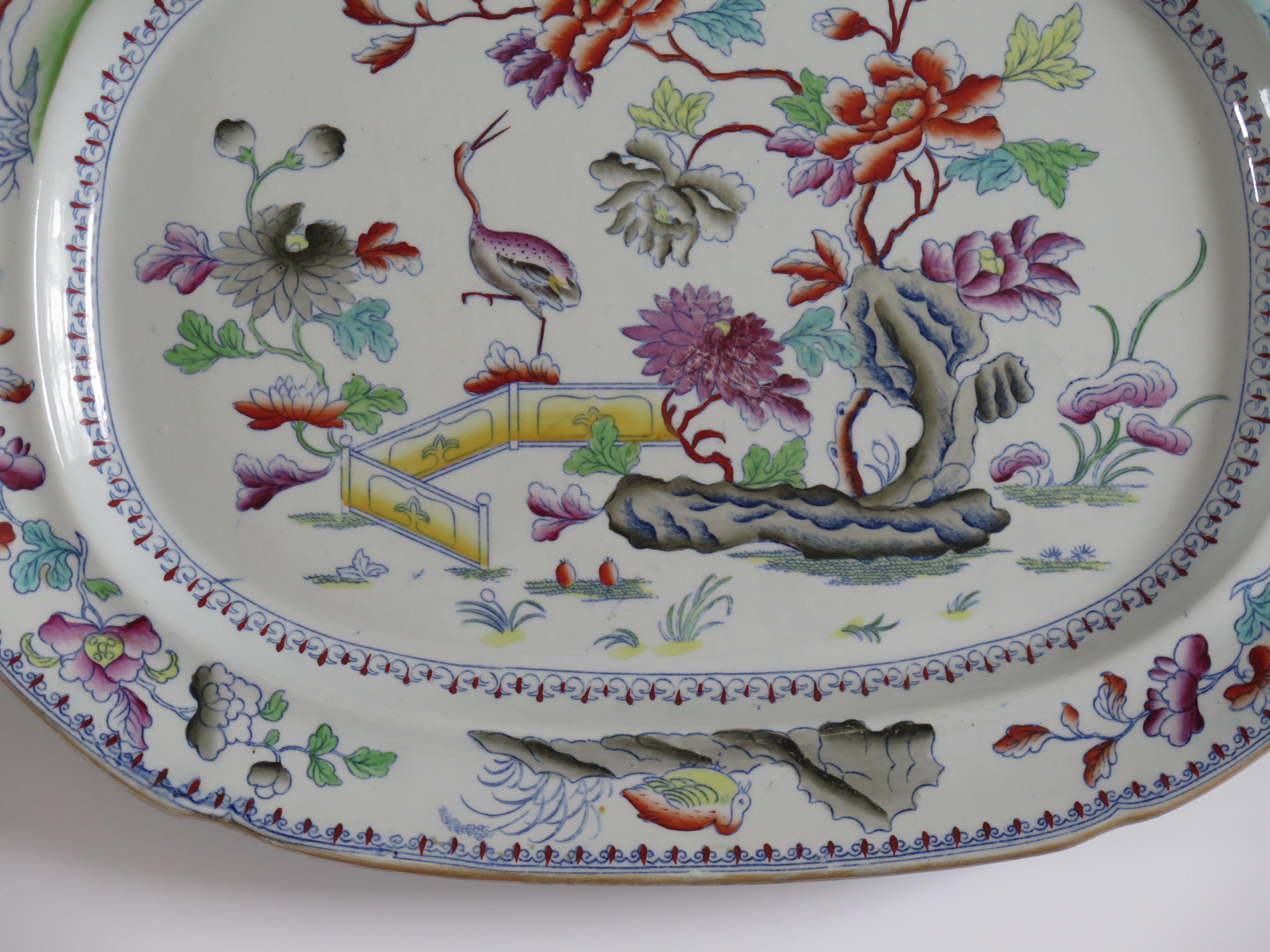 This is a finely hand painted large and rare early Stone China (Ironstone) Meat Plate or Platter, which dates to the George 111 period, circa 1815. Made by the DAVENPORT factory of Longport, Staffordshire Potteries, England.

The platter is very