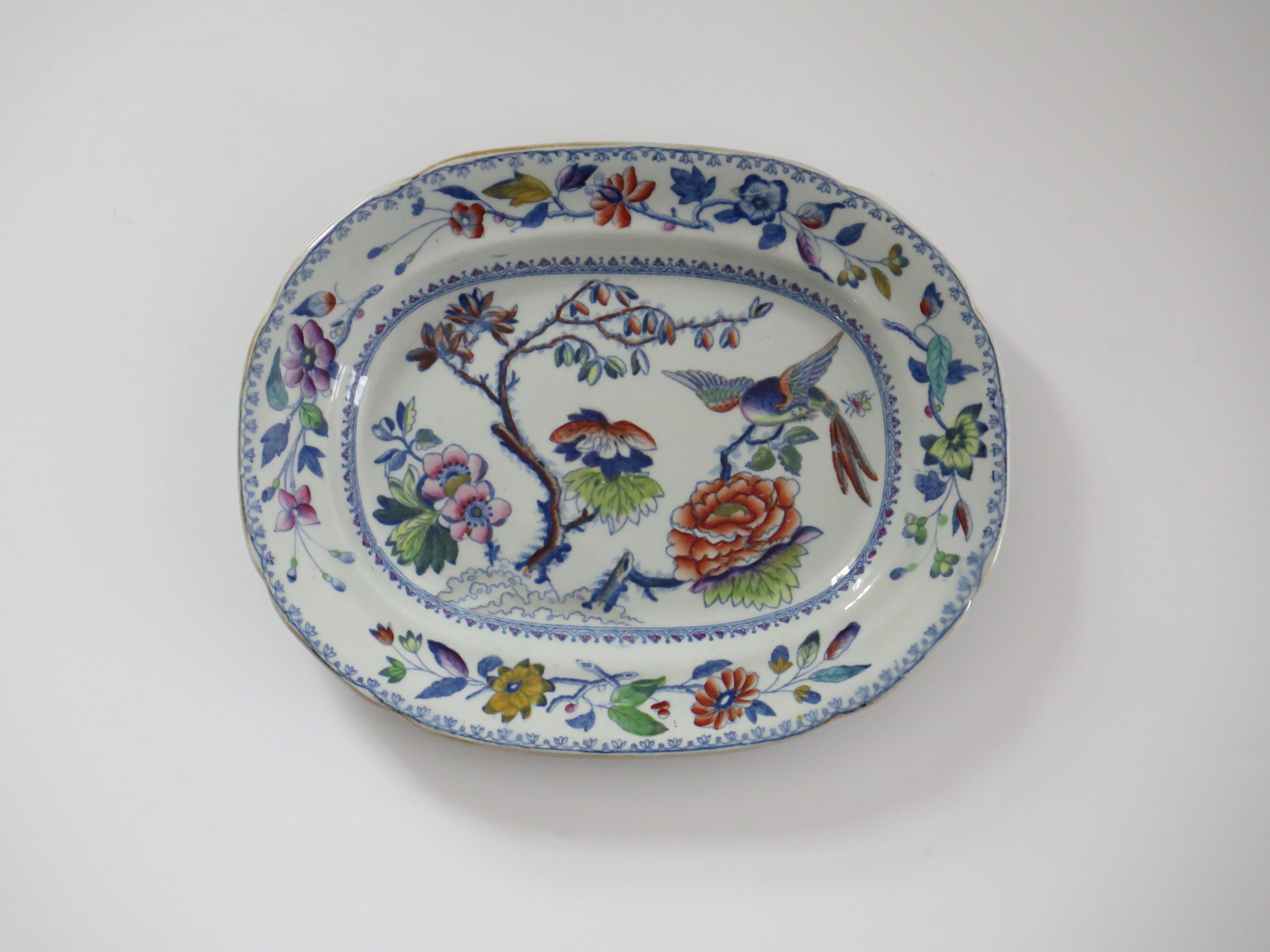 This is a good, hand painted ironstone (stone china) Platter, made by William Davenport and Co., Longport, Staffordshire Potteries, England, circa 1815.

The platter is well potted and hand painted, probably over a blue printed outline, in