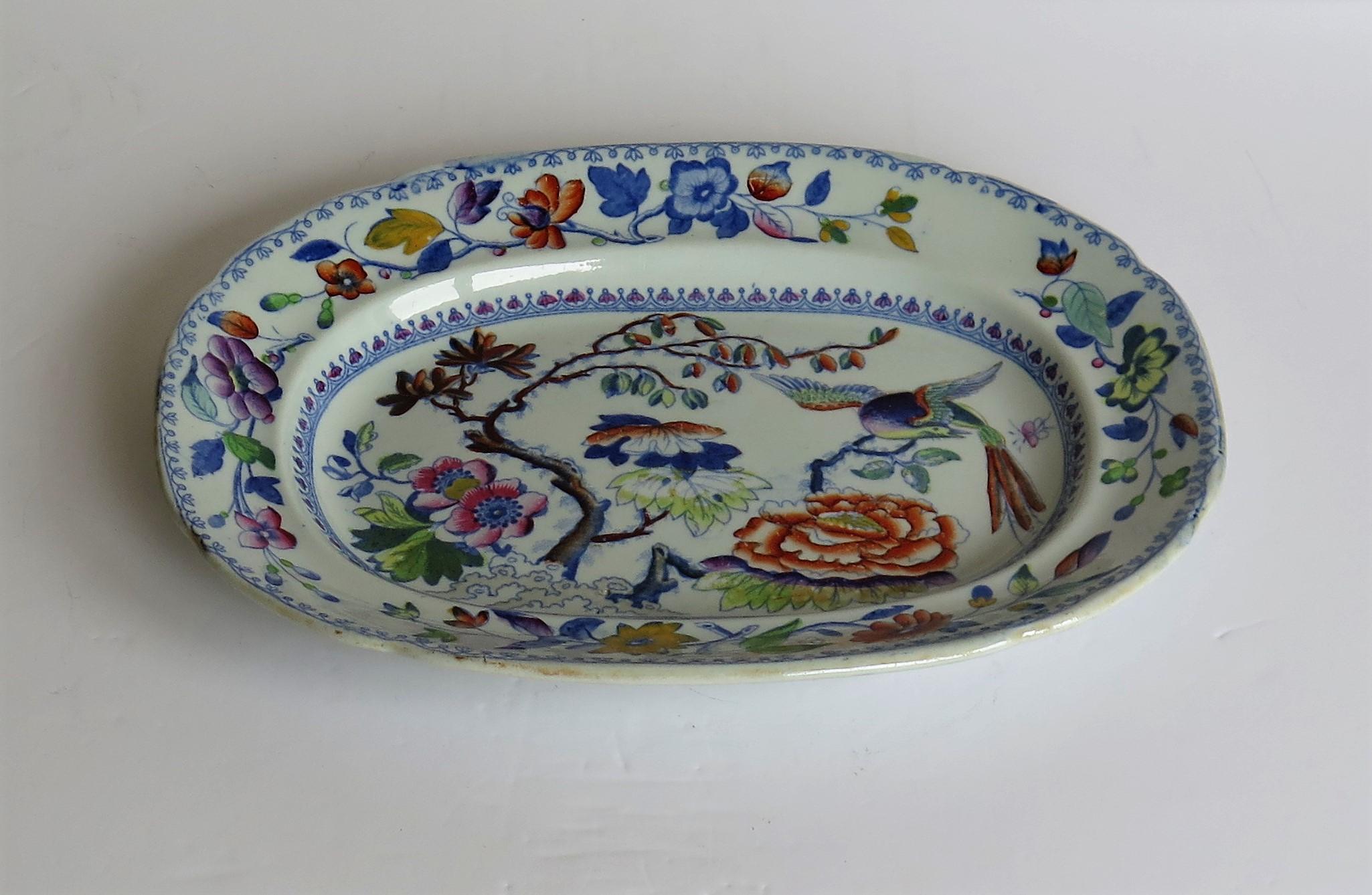 This is a good hand painted ironstone (stone china) Platter, made by William Davenport and Co., Longport, Staffordshire Potteries, England, circa 1820.

The platter is well potted and hand painted, probably over a blue printed outline, in