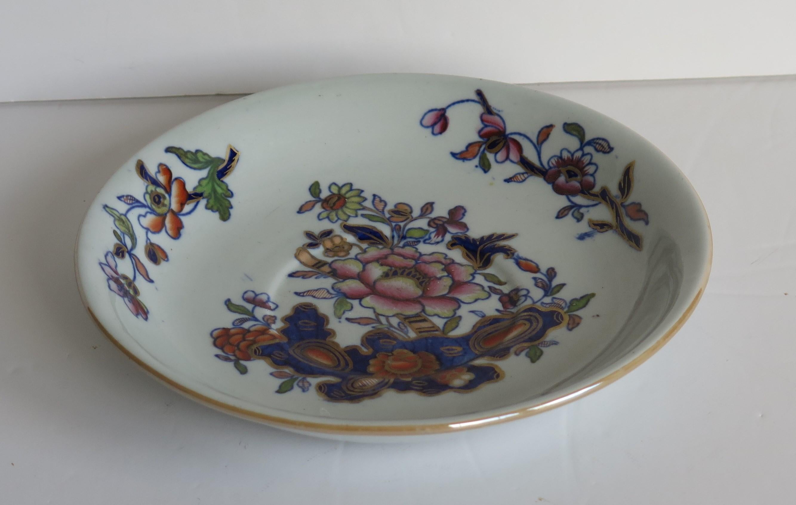 This is a good early hand painted ironstone (stone china) saucer dish or plate, made by William Davenport and Co., Longport, Staffordshire Potteries, England, George 111rd period, circa 1815.

The pattern is number 