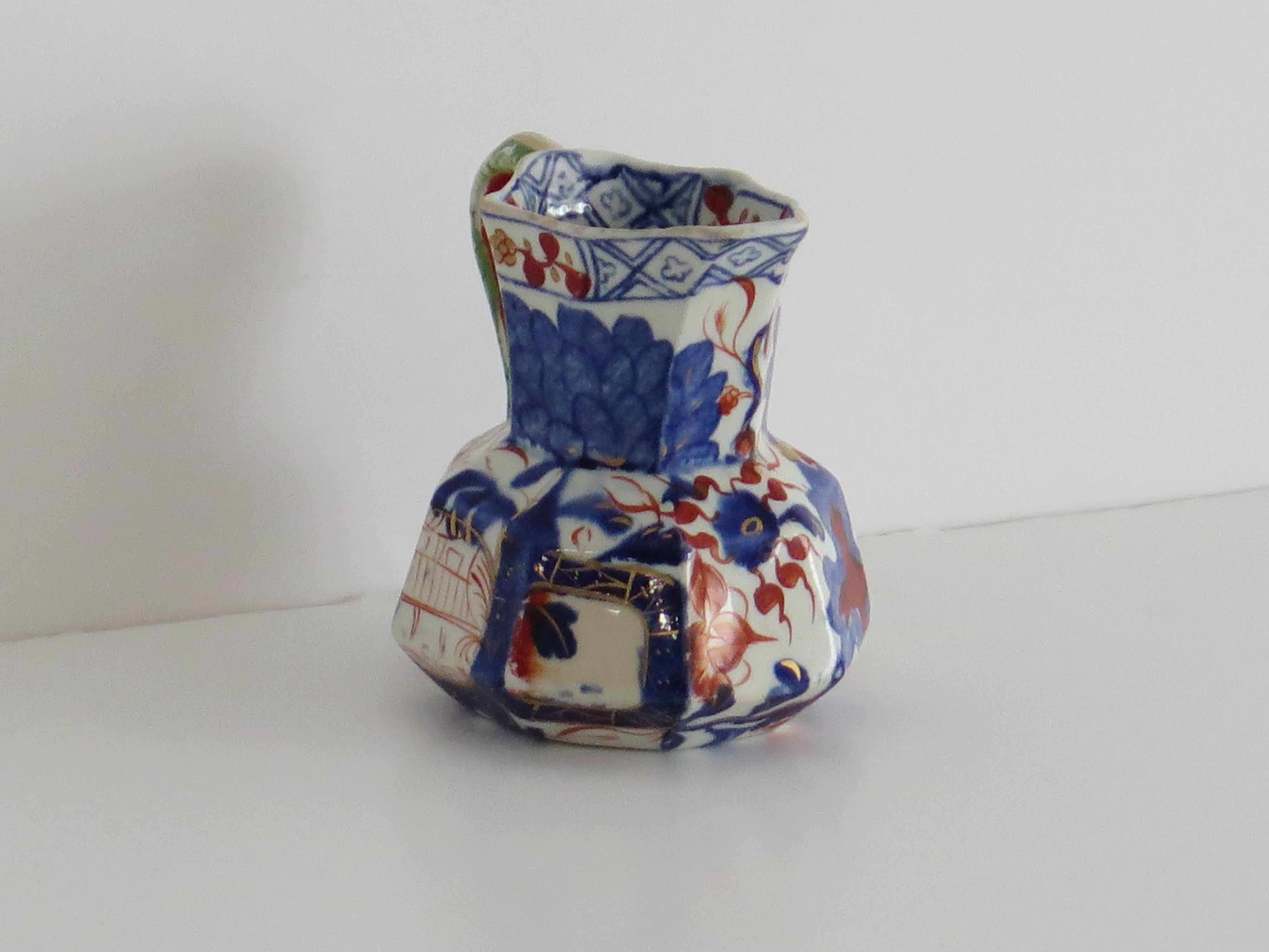 This is a small size antique Hydra jug or Pitcher made by the Davenport Company of Longport, Staffordshire, England in the late Georgian period, circa 1805-1820, made of Ironstone pottery, which Davenport called Stone China.

It is hand decorated