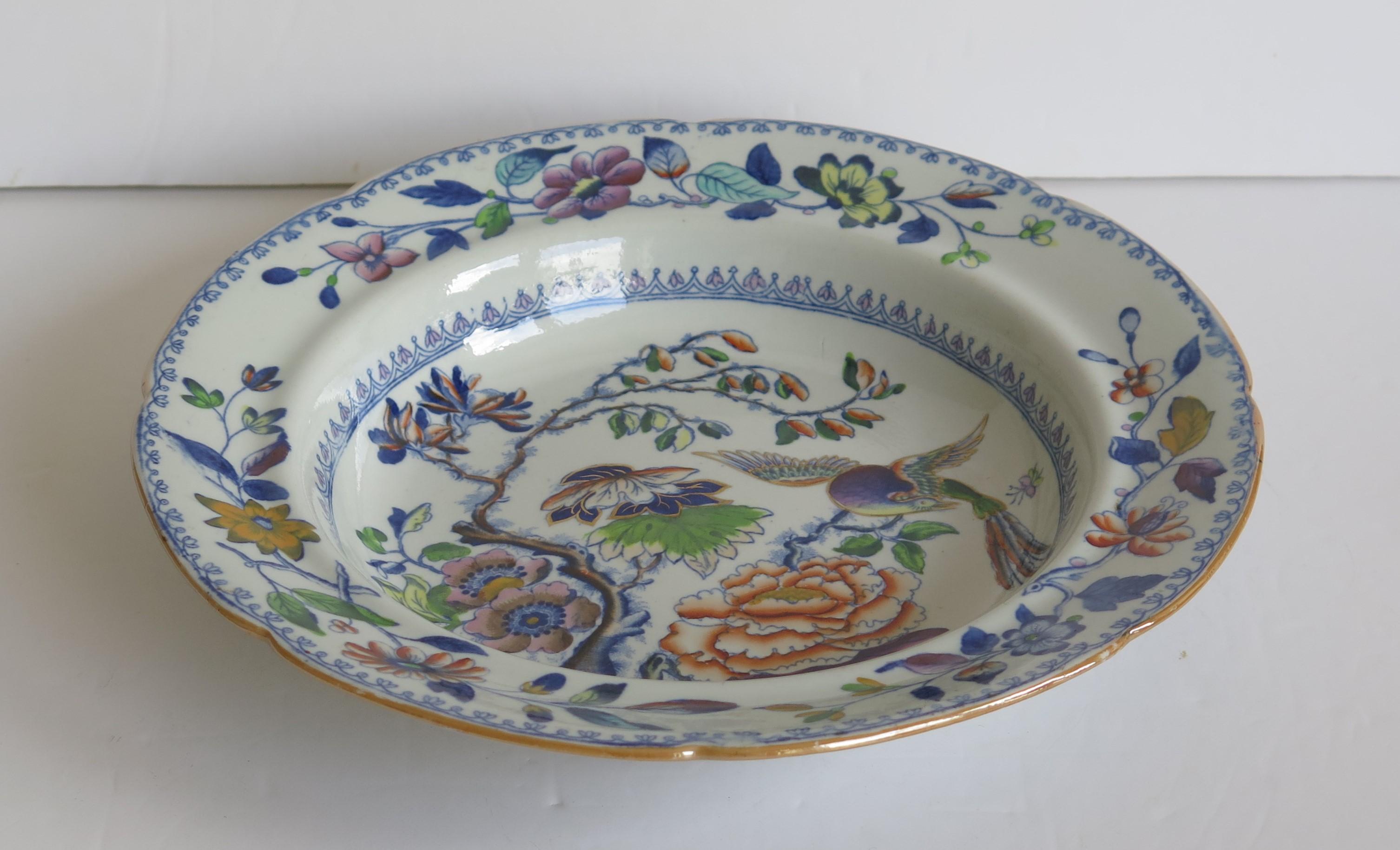 This is a good early hand painted ironstone (stone china) soup bowl or deep plate, made by William Davenport and Co., Longport, Staffordshire Potteries, England, George 111rd period, circa 1815.

The plate is well potted and hand painted, probably