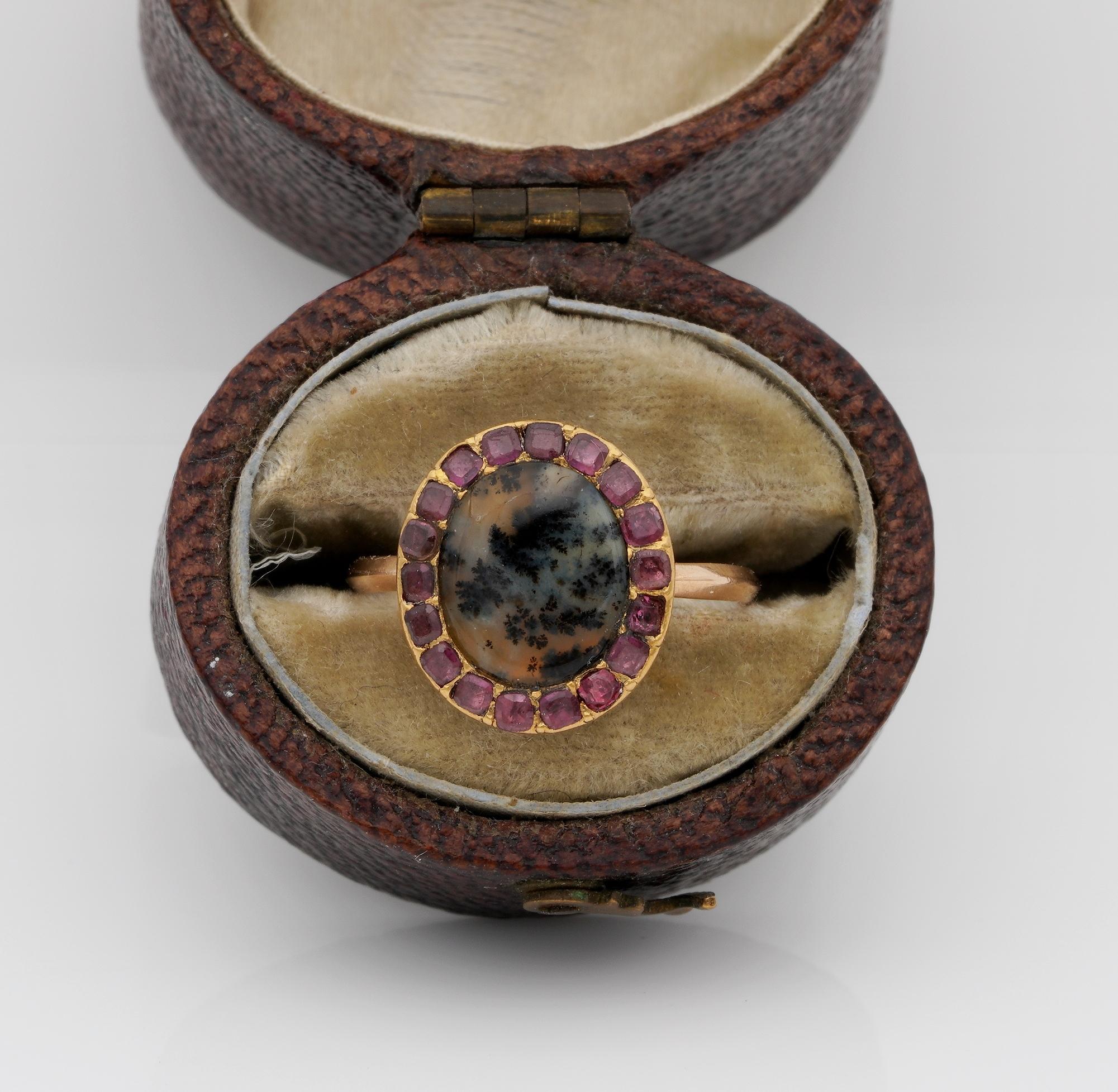 The Magic Georgian Trees
A beautiful Georgian ring set with Dendritic Agate within a border of table cut Garnets
Dendritic Agate is a form of Agate displaying magic landscapes, much loved during the Georgian period, this one in particular shows leaf