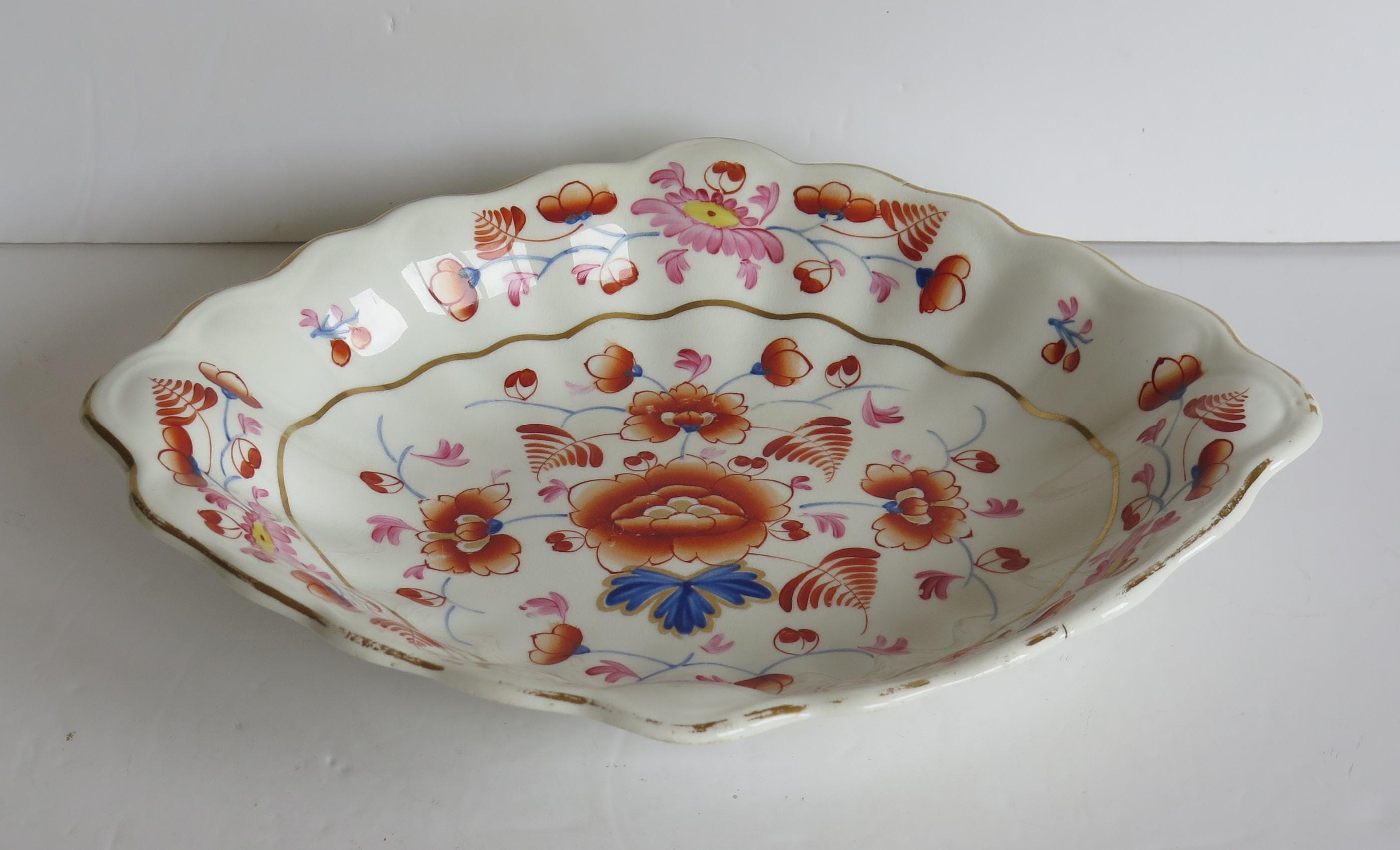 This is a good oval shaped serving dish or bowl, made by the Derby factory, hand painted and gilded in a free flowing floral pattern, during the reign of George 111 in the early 19th century, circa 1815.
 
This is a well potted oval shaped dish or