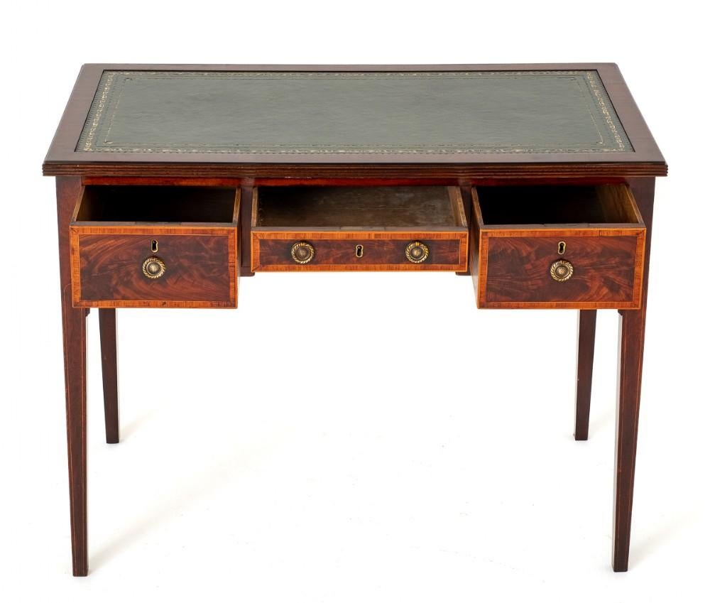 Georgian Mahogany Writing Table.
This Writing Table is Raised upon Tapered Legs with Boxwood Line Inlays.
Having an Arrangement of 3 Oak Lined Drawers (note the fine dovetails)
Circa 1800
The Drawers Feature Highly Figured Mahogany Timbers,