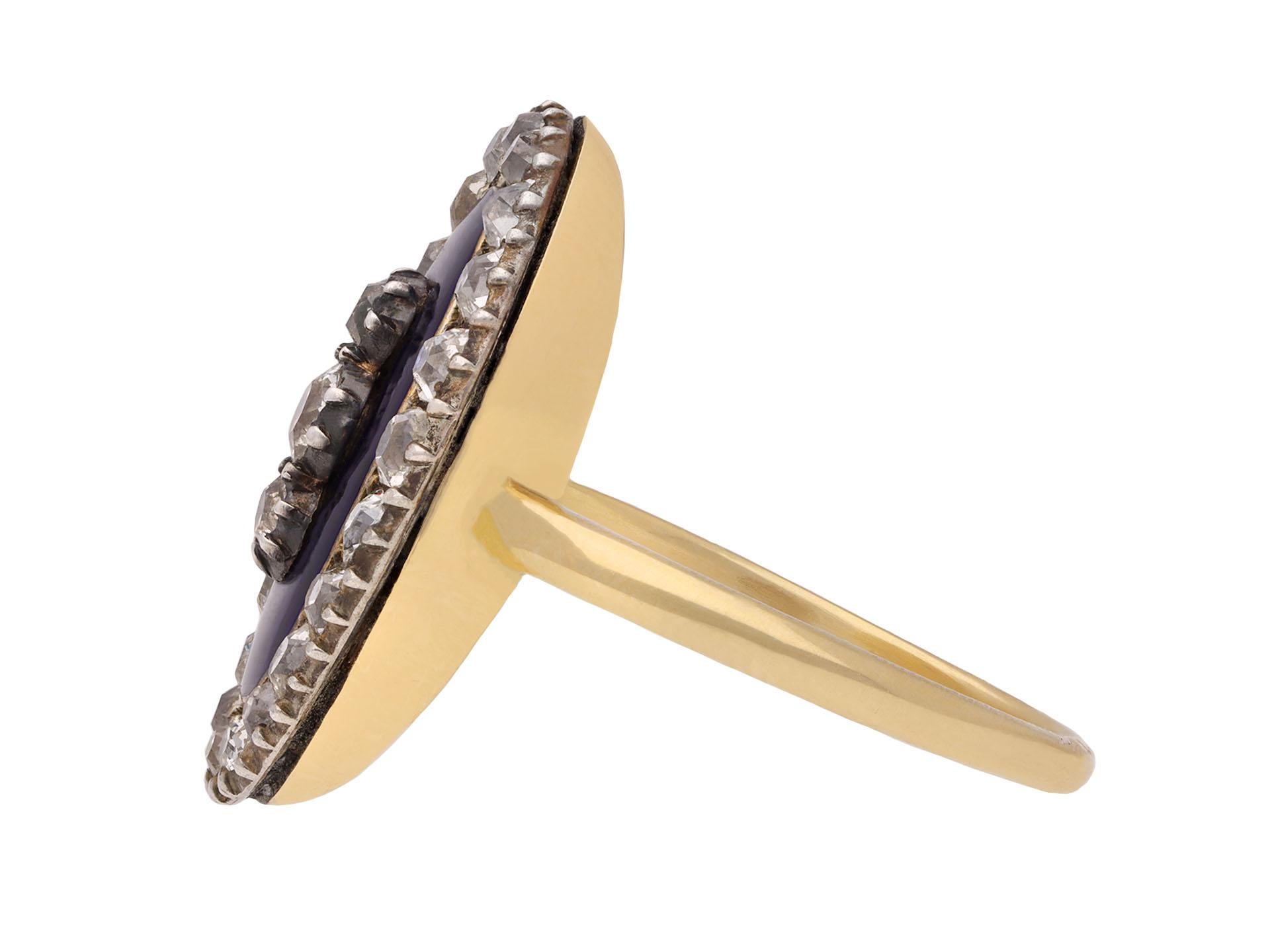 Georgian diamond and enamel memorial ring. Centrally composed of an oval plaque of dark blue engine turned enamel, the centre set with three cushion shaped old mine cut diamonds vertically set in closed back silver cut down settings with a combined