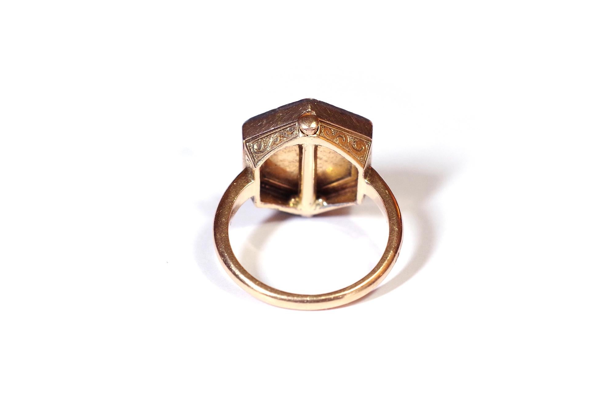 Georgian diamond portrait ring in 18k rose gold and silver. Antique ring composed of a hexagonal bezel enclosing a lady's portrait. The miniature portrait is highlighted by a surround of thirty rose-cut diamonds in a silver setting. The basket is