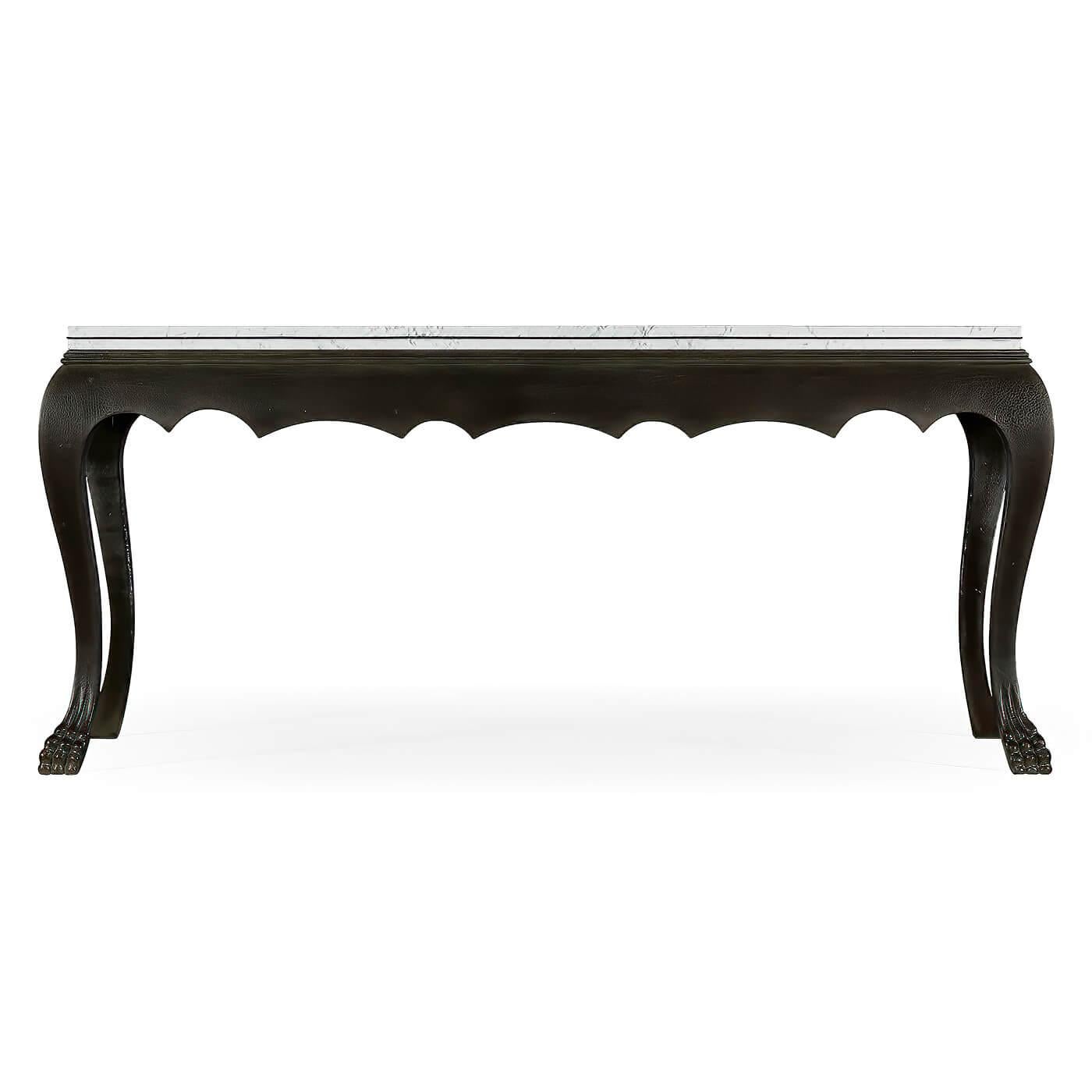 A Georgian style ebonized oak console table with a marble top, molded edge, scalloped apron on cabriole legs and carved paw feet.

Dimensions: 68 1/2