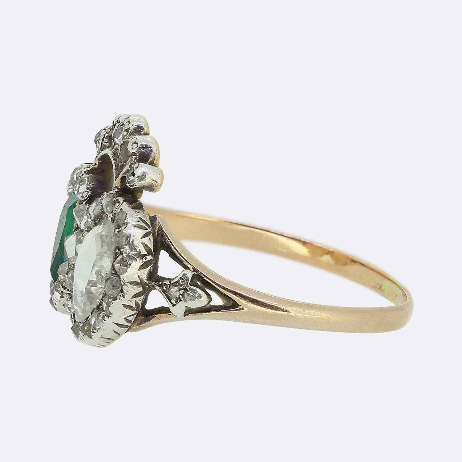 Here we have a delightful double heart ring taken from the Georgian era. This romantic piece showcases a duo of expertly cut pear shaped precious gemstones including an electric green emerald and a bright white chunky rose cut diamond. Both natural