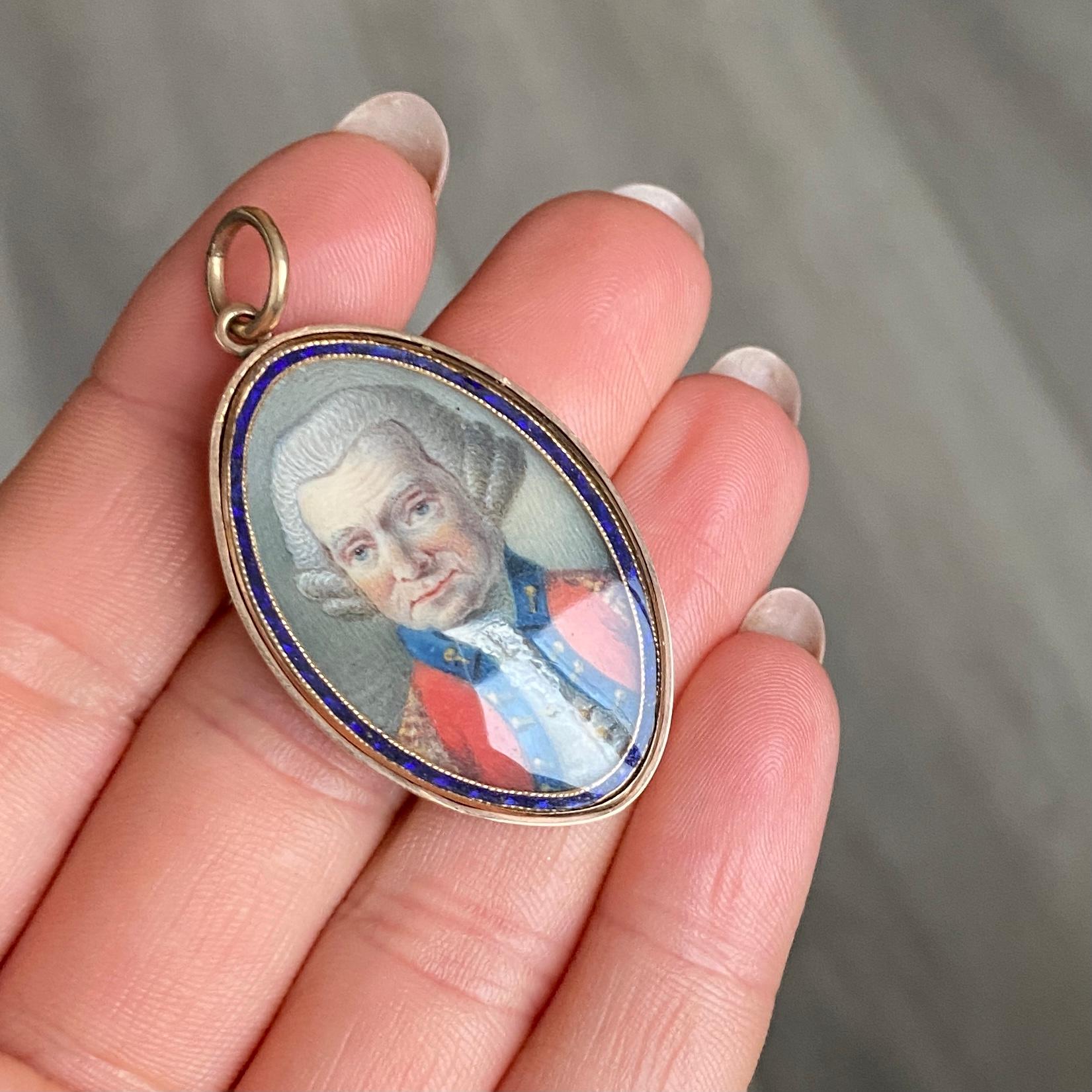 This brooch has navy blue enamel surrounding an exquisite portrait of an officer. The back of the pendant is smooth gold. 

Dimensions: 35x24mm

Weight: 10.2g