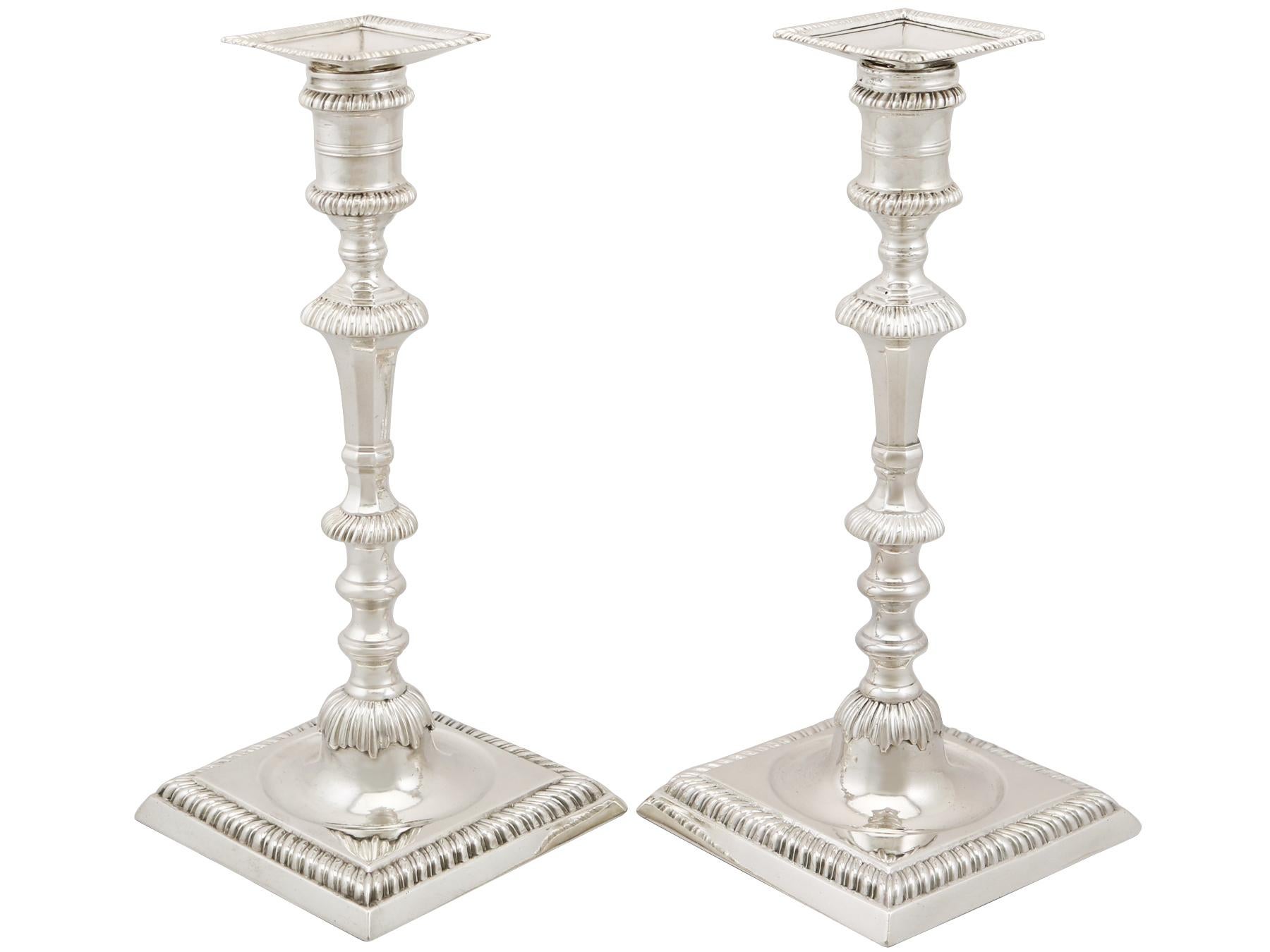 An exceptional, fine and impressive pair of antique George III English sterling silver cast candlesticks; an addition to our Georgian silverware collection.

These exceptional antique George III cast sterling silver candlesticks have a classical